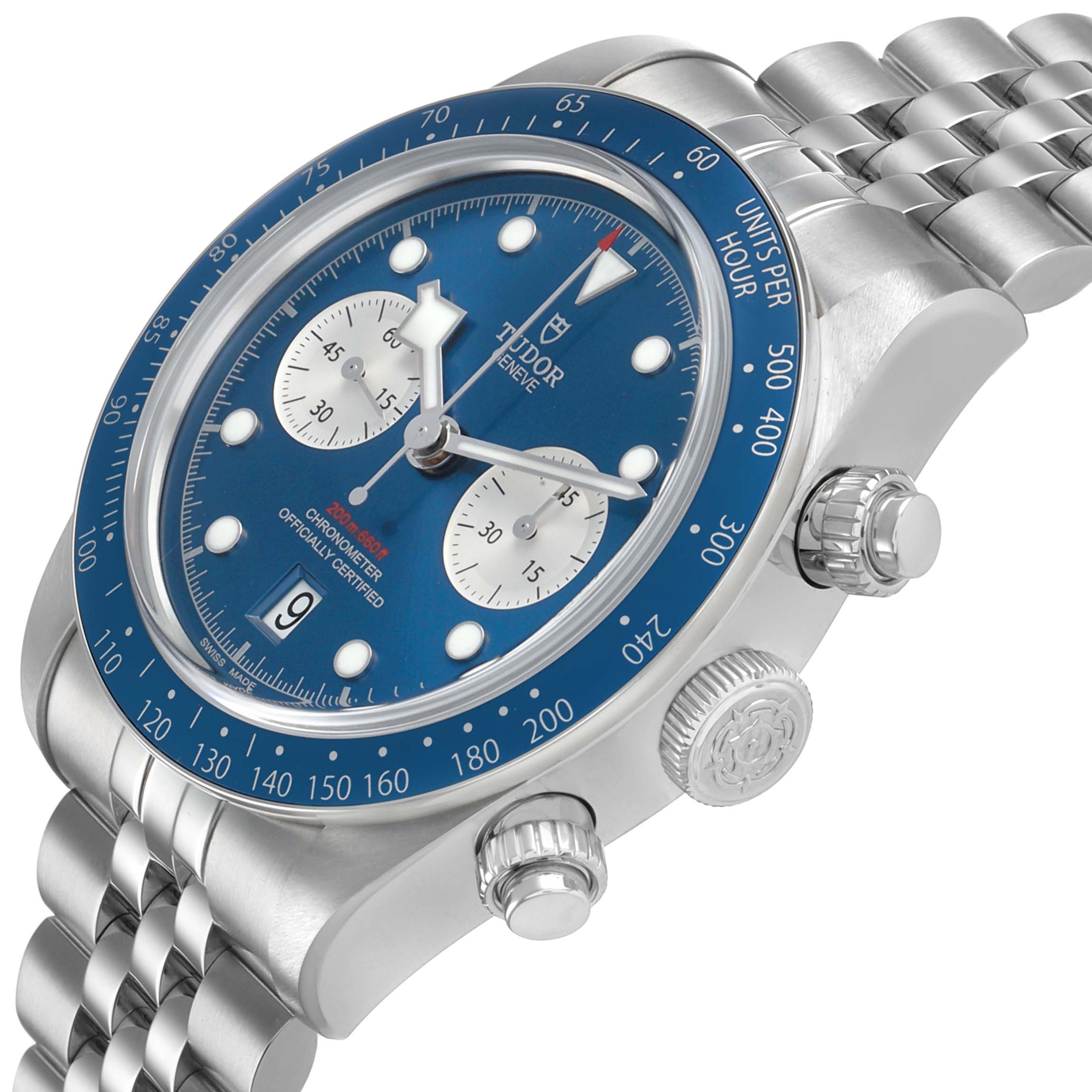 The Tudor Heritage Chrono M79360B-0002 Men's Stainless Steel Blue Dial watch is shown at an angle highlighting its blue dial, subdials, bezel, and steel bracelet.