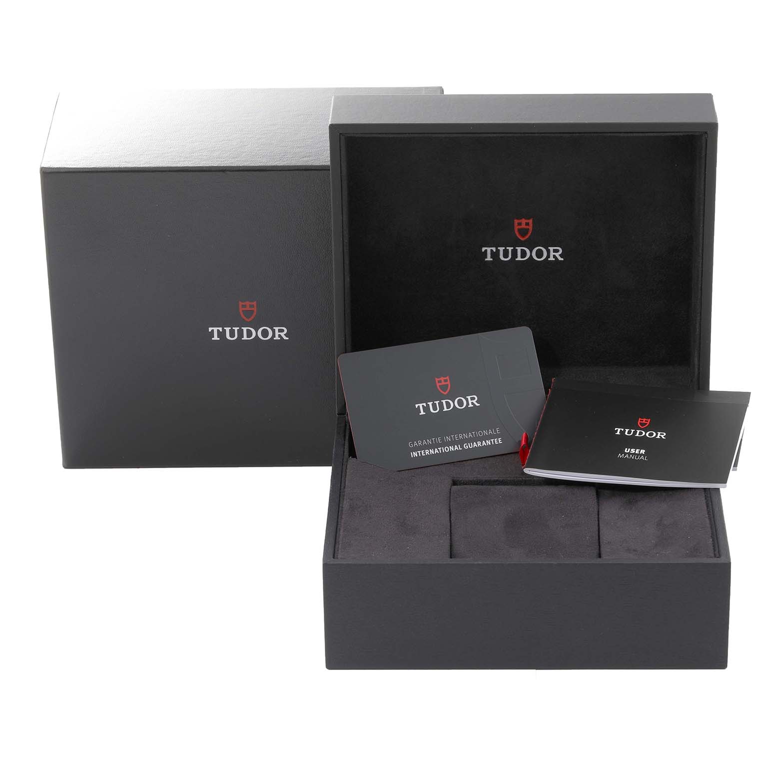 The Heritage Black Bay by Tudor is shown in its box with accompanying documents and guarantee card.