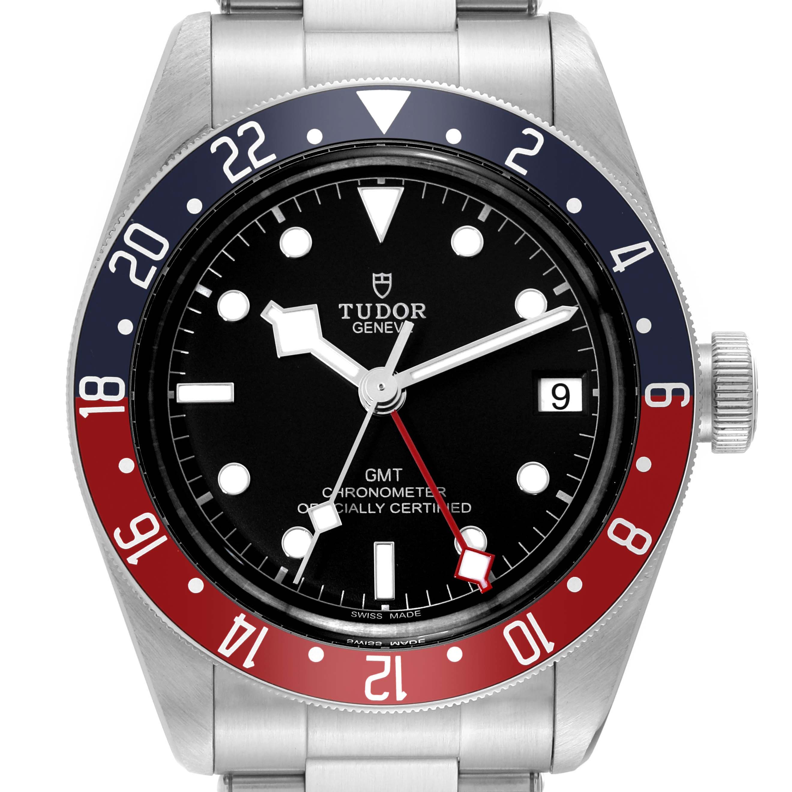 The Heritage Black Bay by Tudor is shown from a top-down angle, displaying the watch face, bezel, and part of the bracelet.