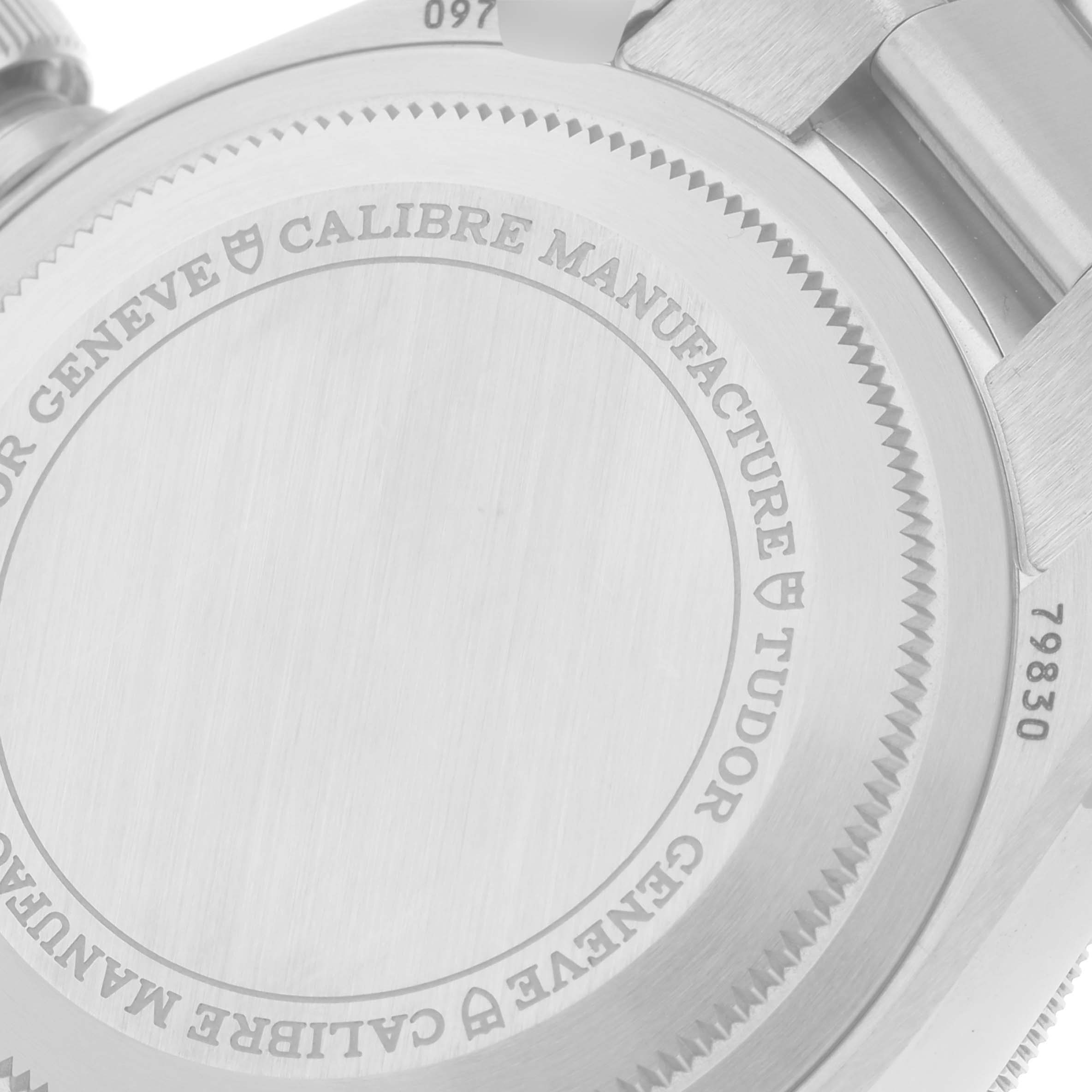 The image shows a close-up of the case back of the Tudor Heritage Black Bay 79830RB Men's Stainless Steel Silver Dial 79830RB Men's Stainless Steel Silver Dial watch, highlighting the engraving and serial number.