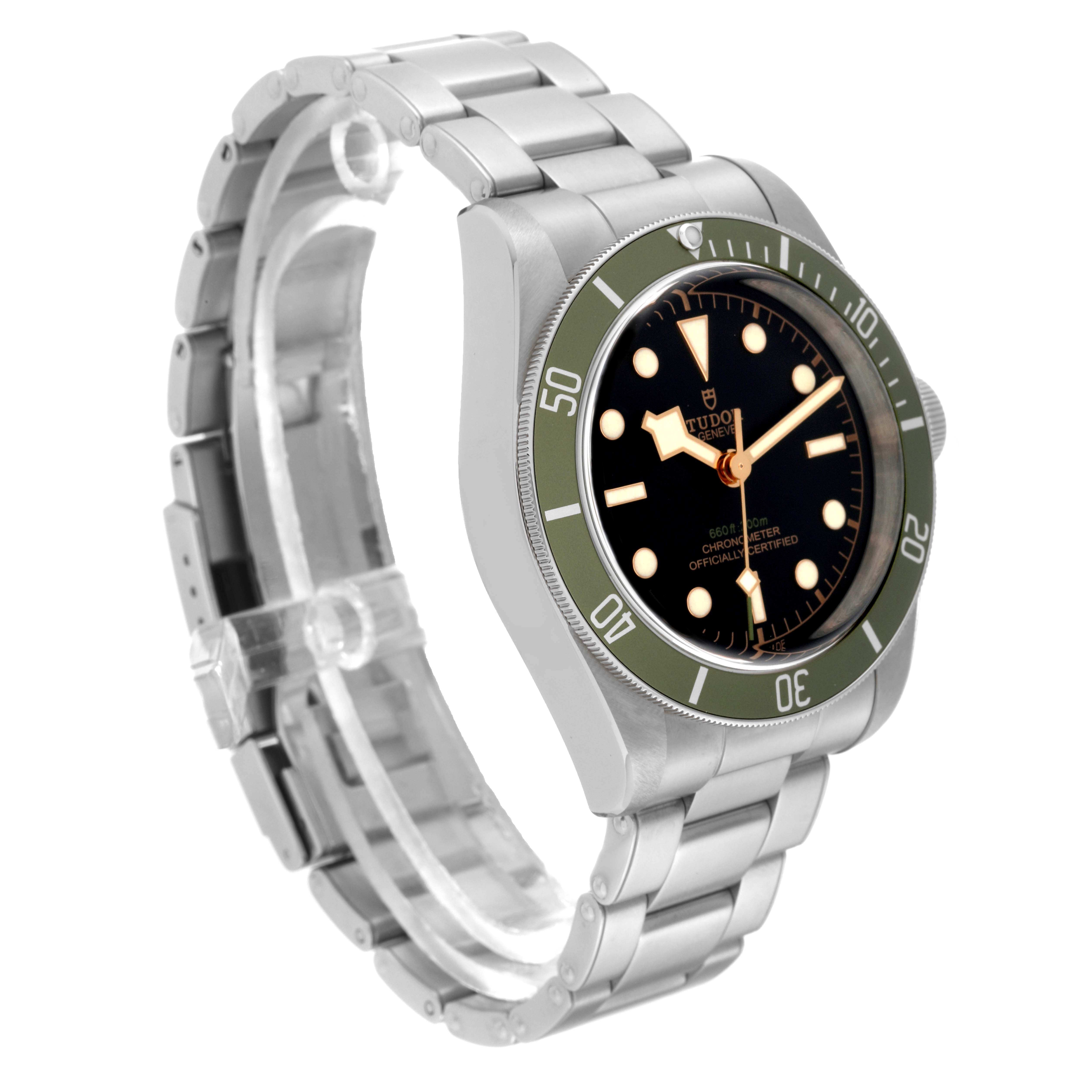 The watch shown is a Tudor Heritage Black Bay 79230G Men's Stainless Steel Black Dial 79230G Men's Stainless Steel Black Dial model, depicted at an angle showcasing its face, bezel, and stainless steel strap.