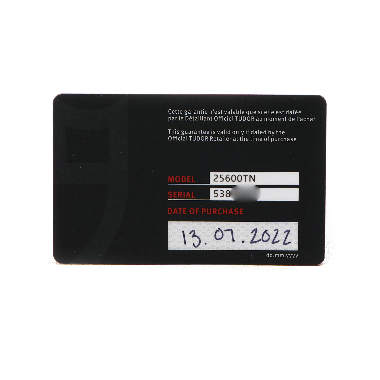 The image shows a warranty card for the Tudor Heritage Chrono 25600TN Men's Titanium Black Dial, featuring model, serial number, and purchase date details.