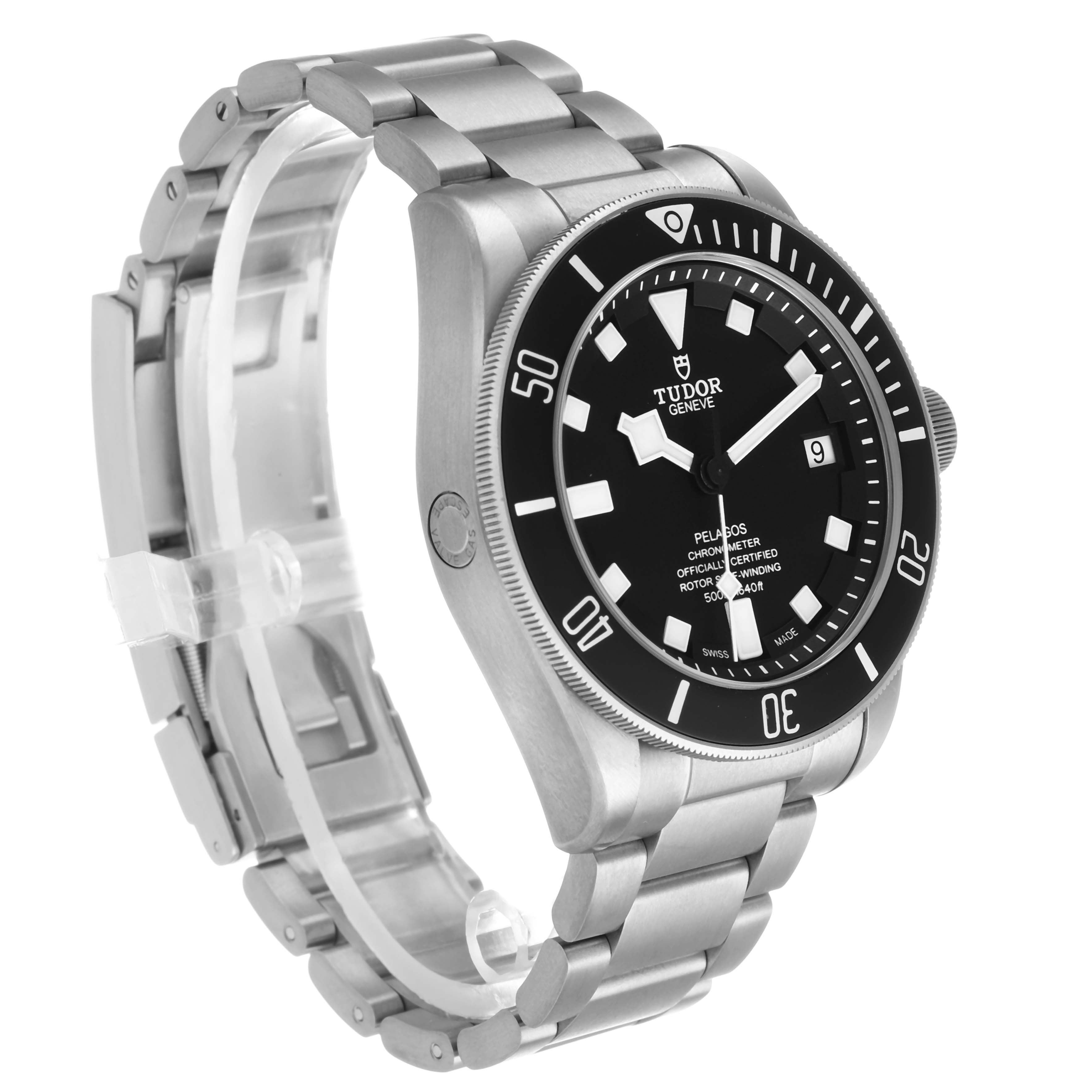 The Tudor Heritage Chrono 25600TN Men's Titanium Black Dial watch is shown from a front-right angle, highlighting its dial, bezel, and bracelet.