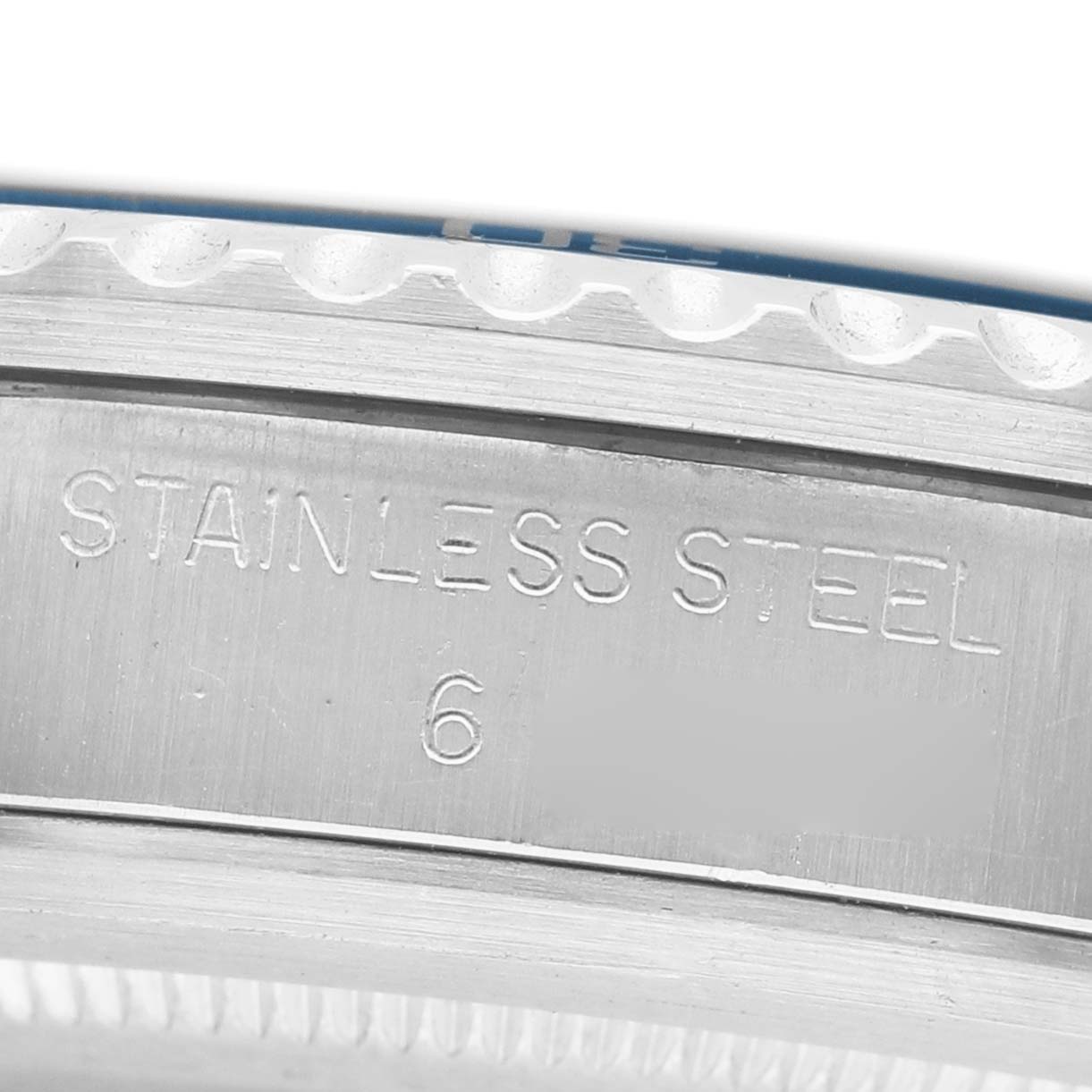 The image shows a close-up of the Tudor Prince 76100 Men's Stainless Steel Blue Dial model's stainless steel side, featuring engraved text.