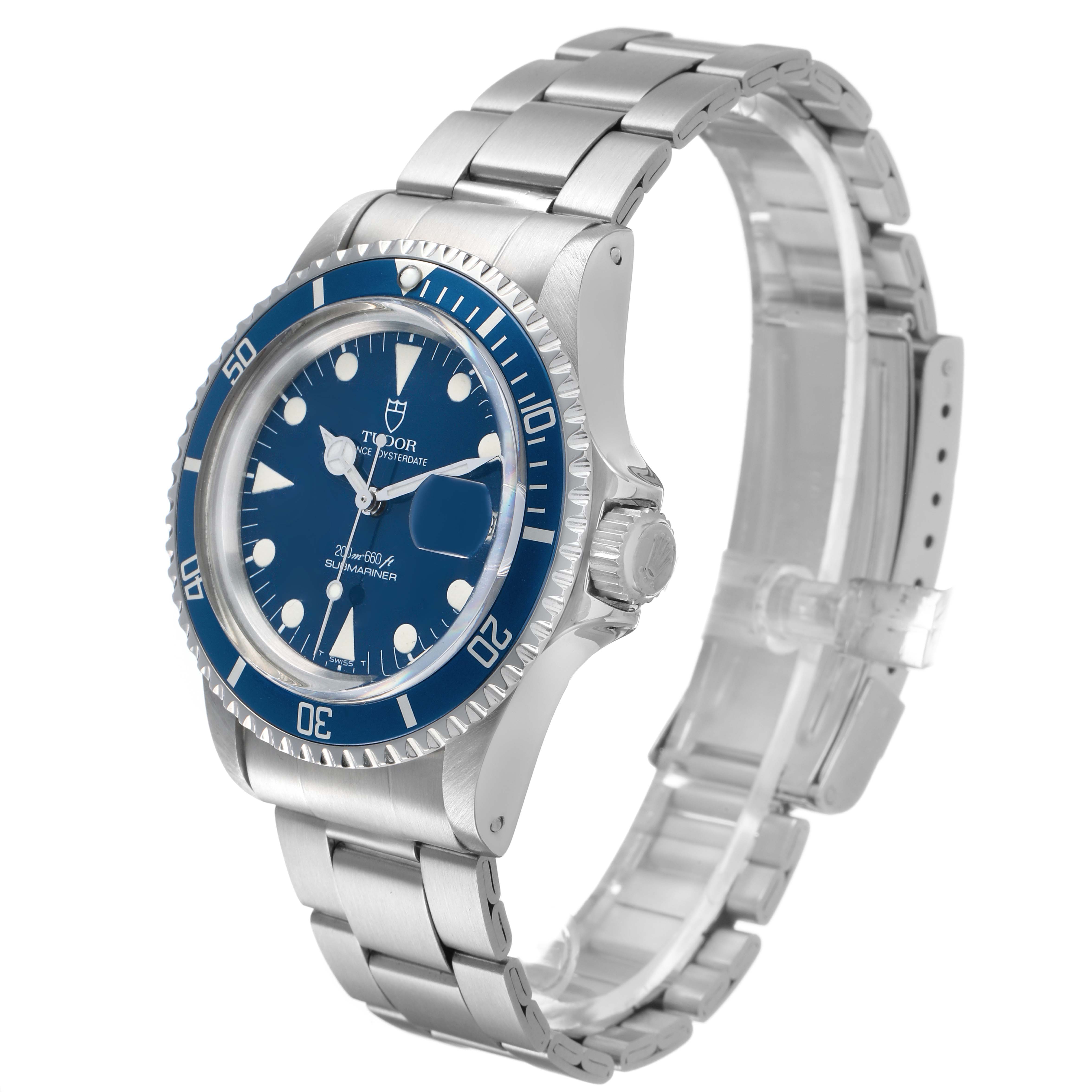 The Tudor Prince 76100 Men's Stainless Steel Blue Dial model watch is shown at a three-quarter angle, highlighting the blue dial, bezel, crown, and stainless steel bracelet.