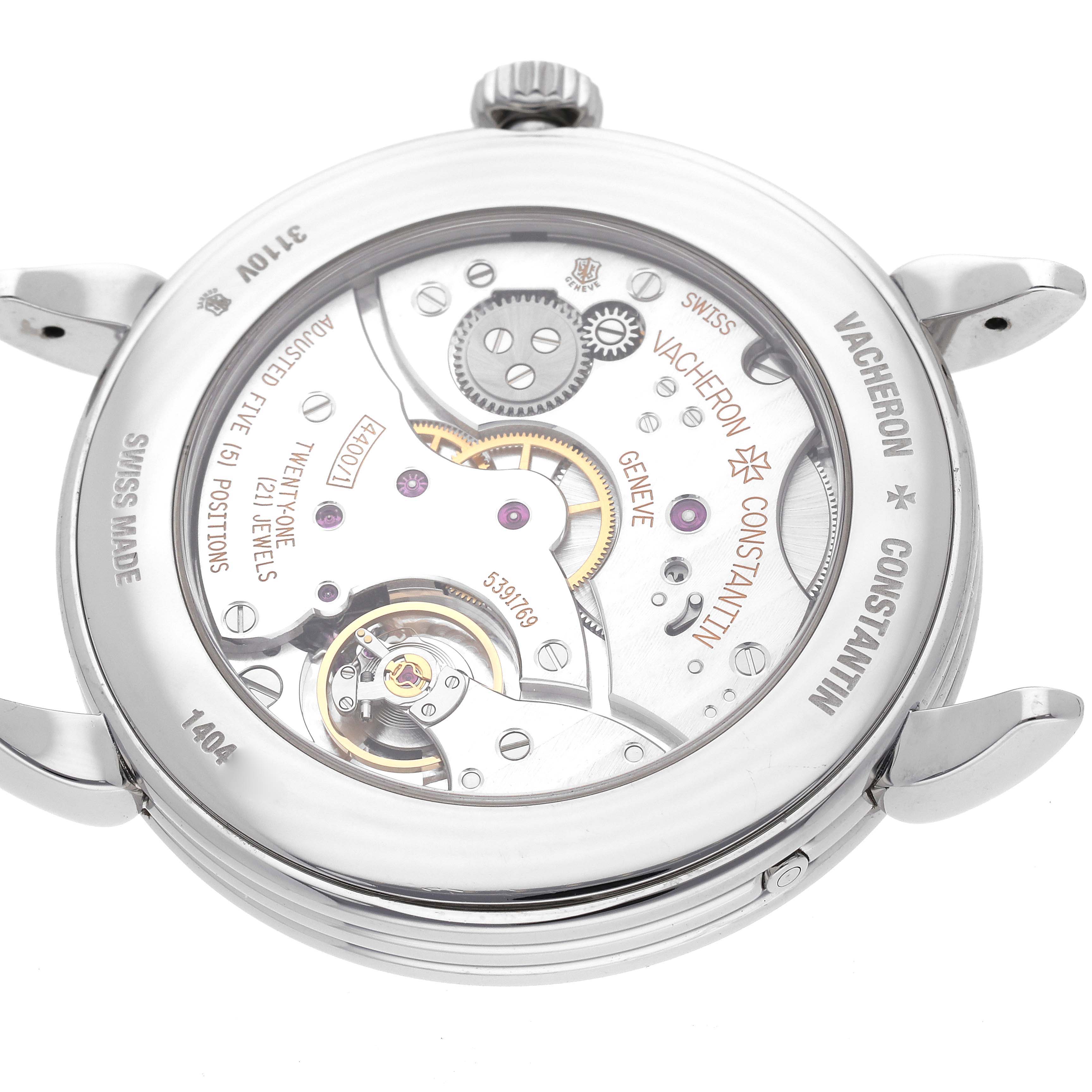 The image shows the back view of a Vacheron Constantin Historiques 3110V/000A-B426 Men's Stainless Steel Beige Dial 3110V/000A-B426 Men's Stainless Steel Beige Dial watch, displaying its intricate internal movements and components.