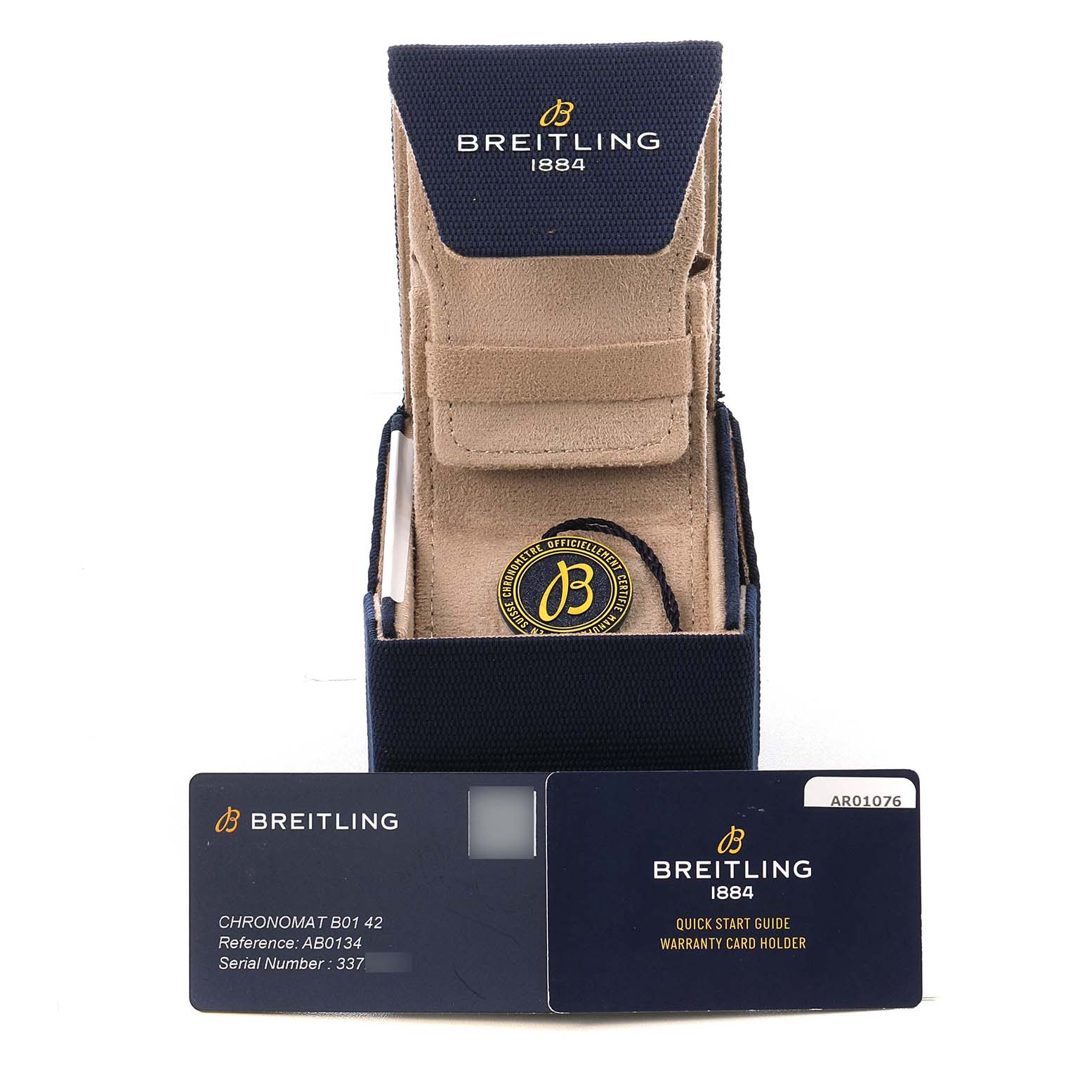 The image shows a Breitling Chronomat AB0134101C1A1 Men's Stainless Steel Blue Dial watch case with a warranty card and quick start guide in front, viewed from the front.