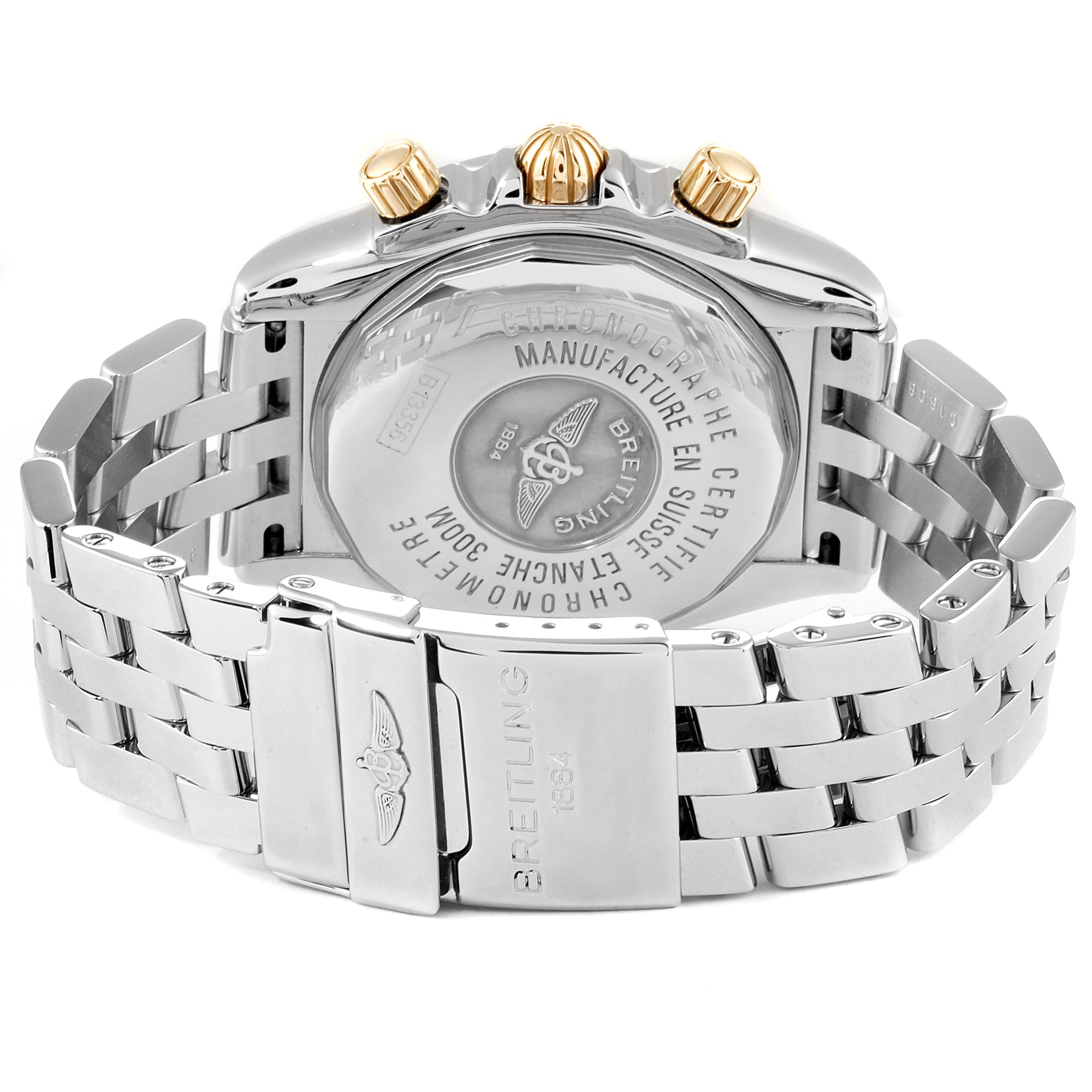 This image shows the rear view of the Breitling Chronomat B13356 Men
s Steel and Gold (two tone) Black Dial B13356 Men
s Steel and Gold (two tone) Black Dial watch, highlighting its stainless steel back, bracelet, and clasp.