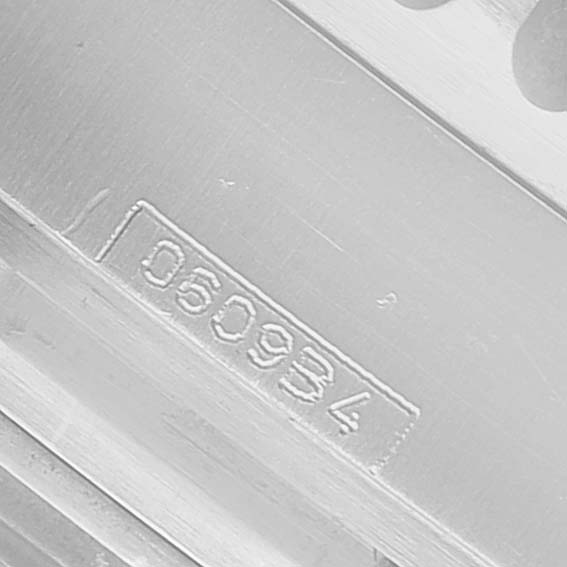 The image shows a close-up of the engraved serial number on the case back of a Breitling Navitimer A23322 / A232G09NP Men's Stainless Steel Silver Dial watch.