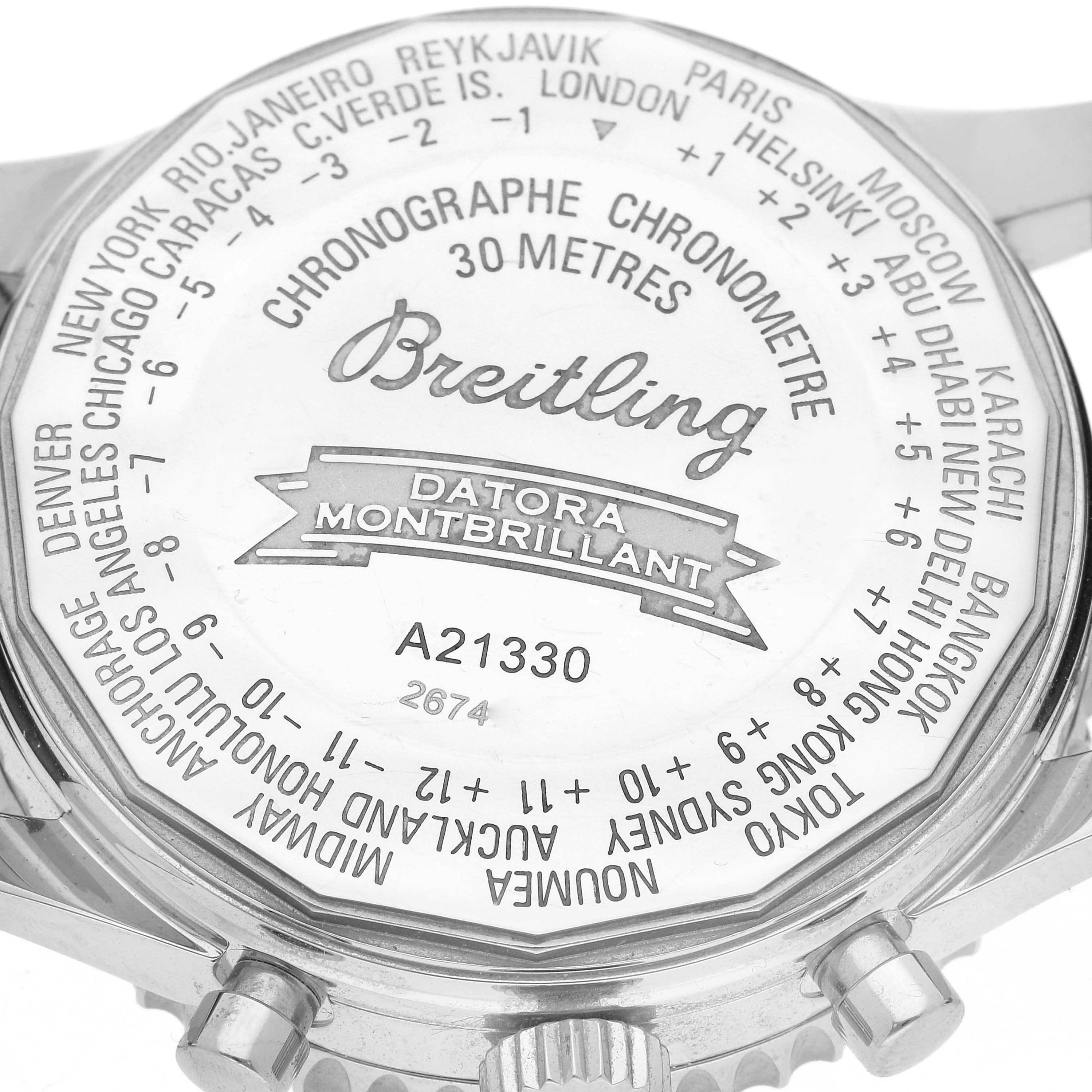 This image shows the case back of a Breitling Navitimer A21330 Men
s Stainless Steel Black Dial A21330 Men
s Stainless Steel Black Dial Datora Montbrillant model watch, depicting the time zone markings and model information.