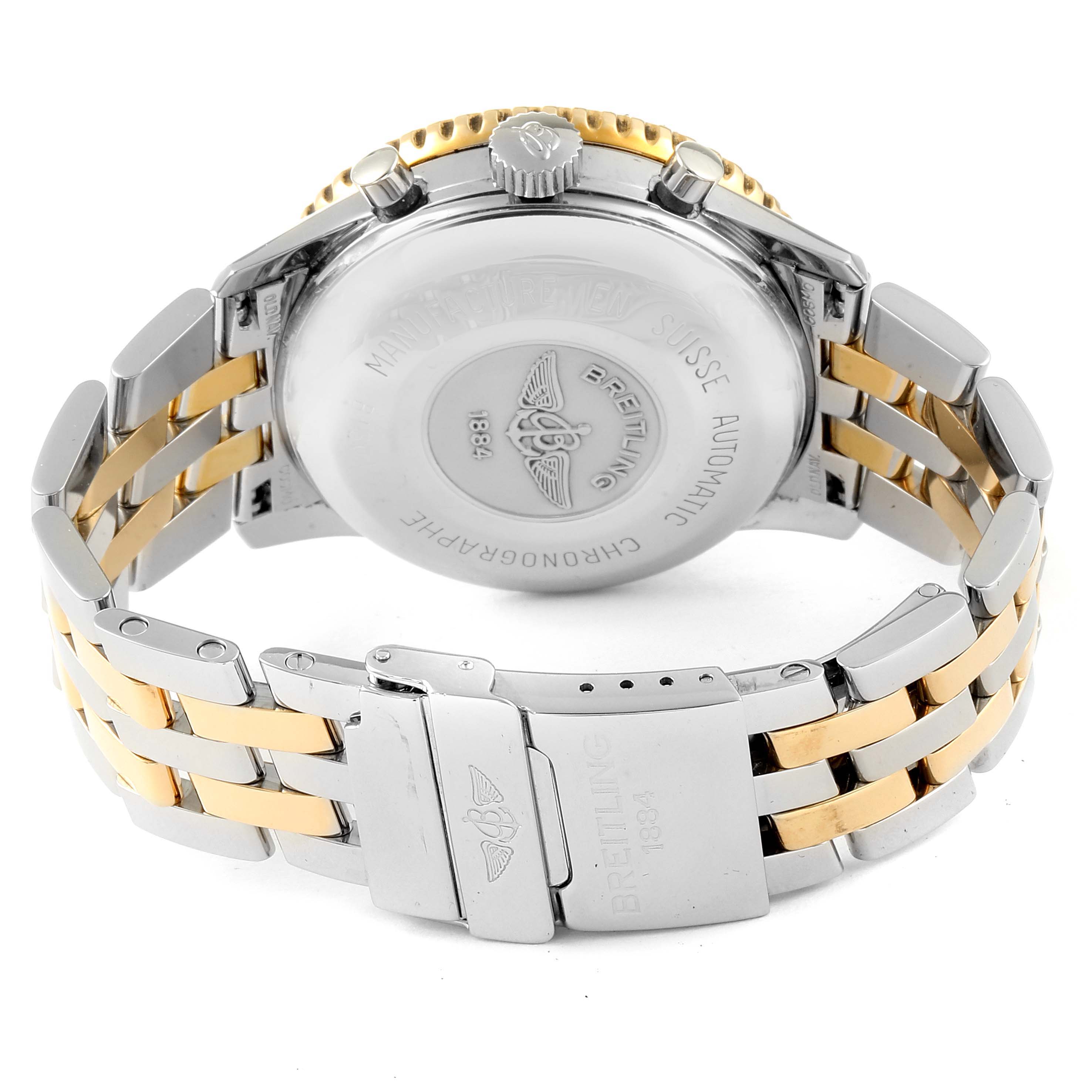 The image shows the back case, crown, pushers, and bracelet of a Breitling Navitimer B13019 Men's Steel and Gold (two tone) Black Dial B13019 Men's Steel and Gold (two tone) Black Dial watch.