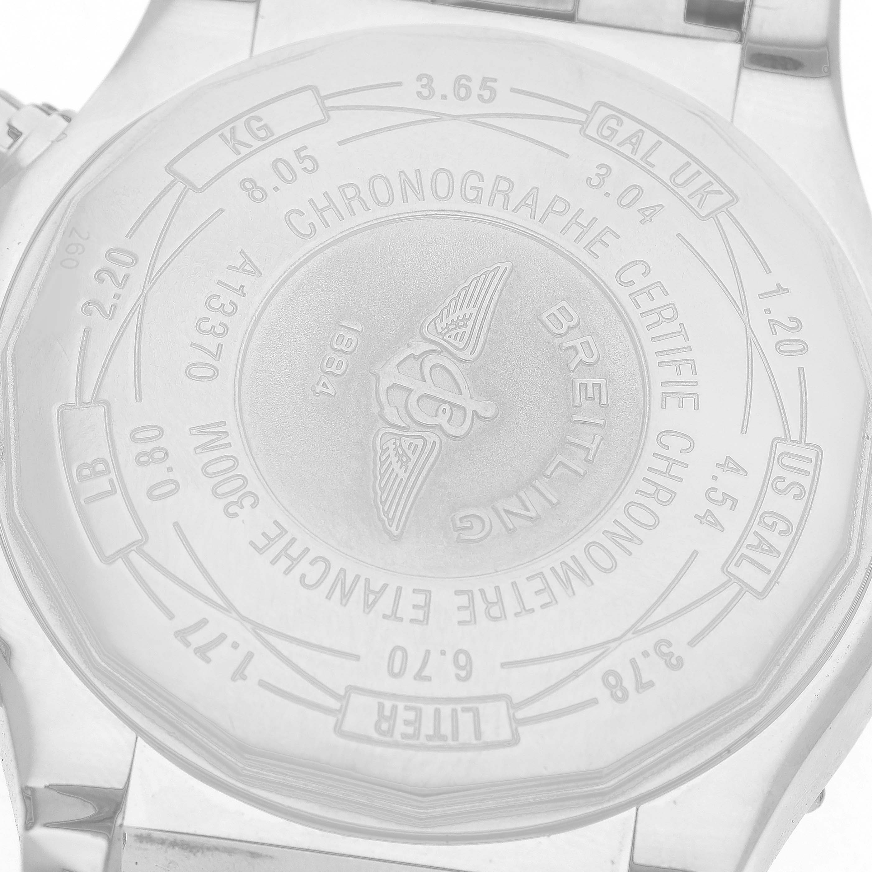 The image shows the back case of a Breitling Avenger A1337011 / B907 Men's Stainless Steel Black Dial watch, featuring engravings and branding details.