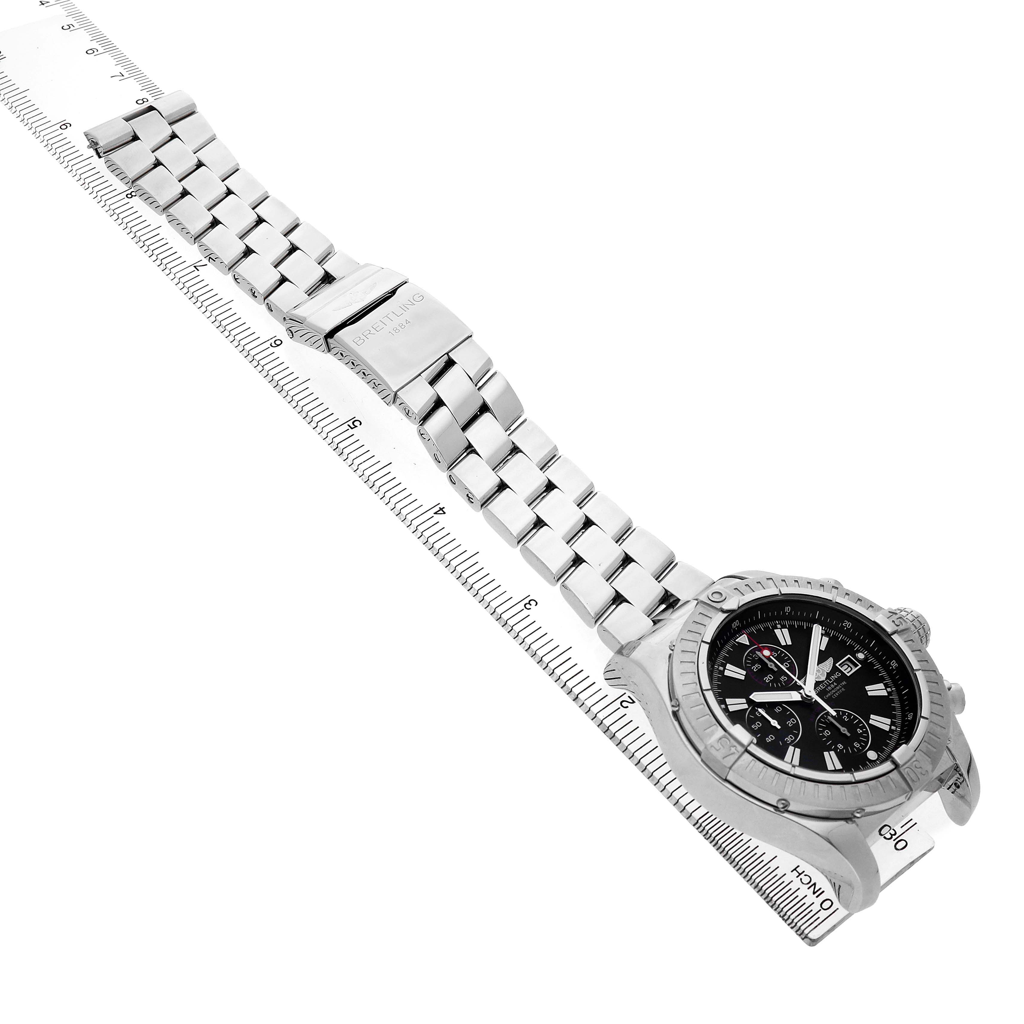 The Breitling Avenger A1337011 / B907 Men's Stainless Steel Black Dial watch is shown at an angle displaying the bracelet, clasp, and face with a ruler alongside.