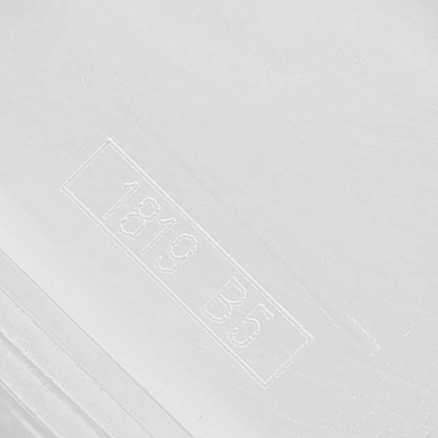 This image shows a close-up of a serial number, likely on the packaging or casing for the Breitling Avenger A1337011 / B907 Men's Stainless Steel Black Dial watch.