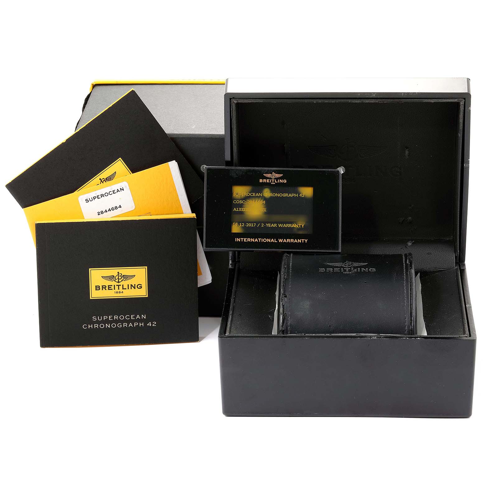 The image shows a Breitling Superocean A13311 Men
s Stainless Steel Blue Dial A13311 Men
s Stainless Steel Blue Dial watch box, warranty card, manuals, and documents from a front angle.