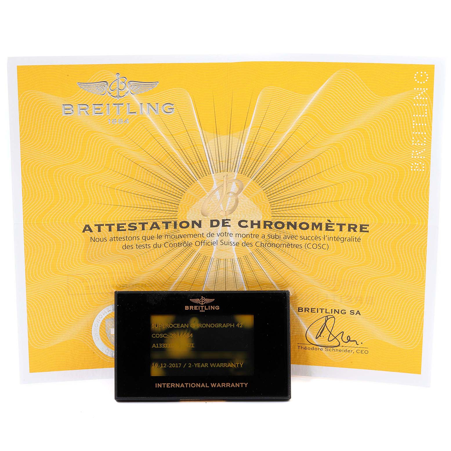 The image shows the certification and international warranty card for a Breitling Superocean A13311 Men
s Stainless Steel Blue Dial A13311 Men
s Stainless Steel Blue Dial watch.