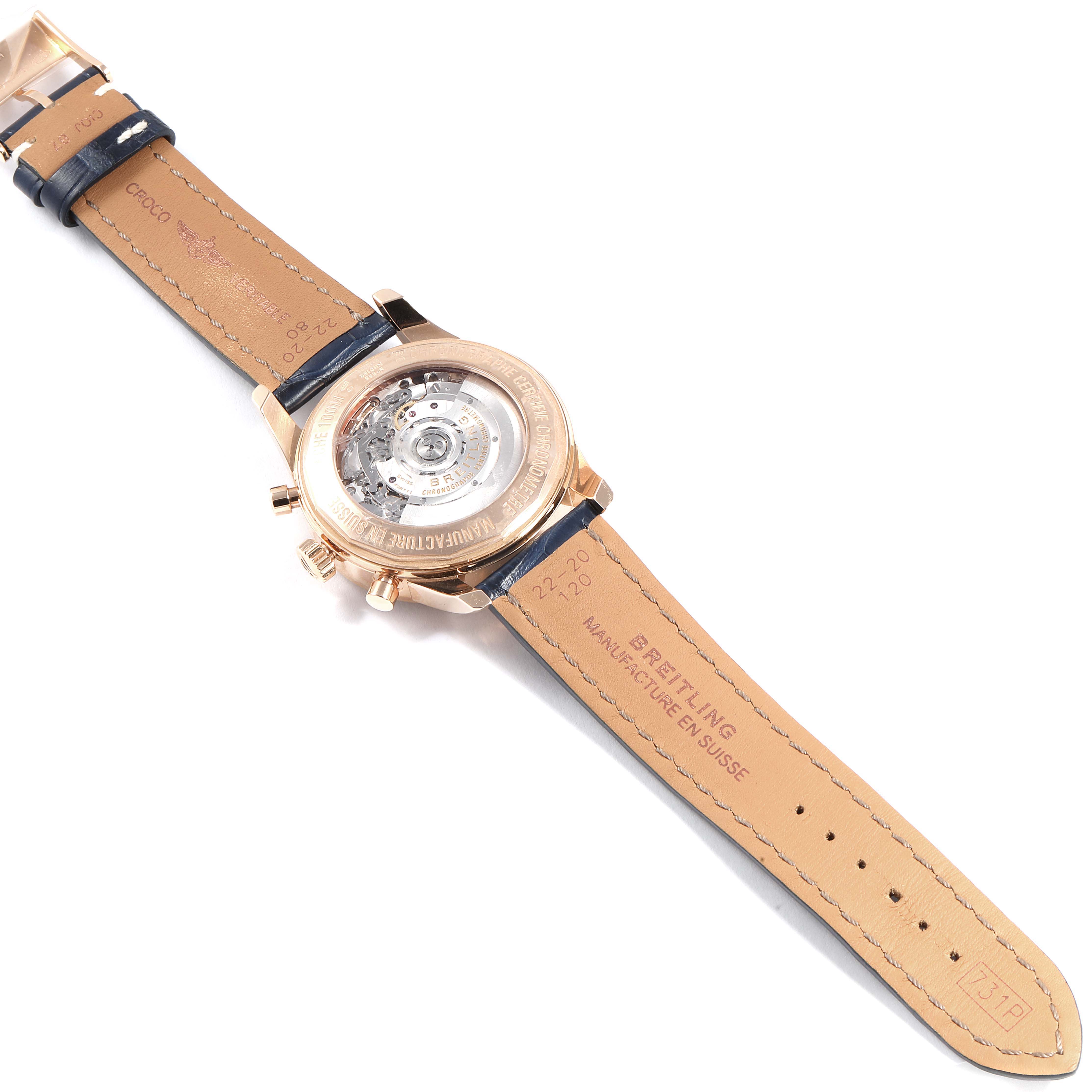 The image shows the back view of a Breitling Transocean RB0152 Men's Rose Gold Silver Dial RB0152 Men's Rose Gold Silver Dial watch, highlighting the open case back and leather strap.