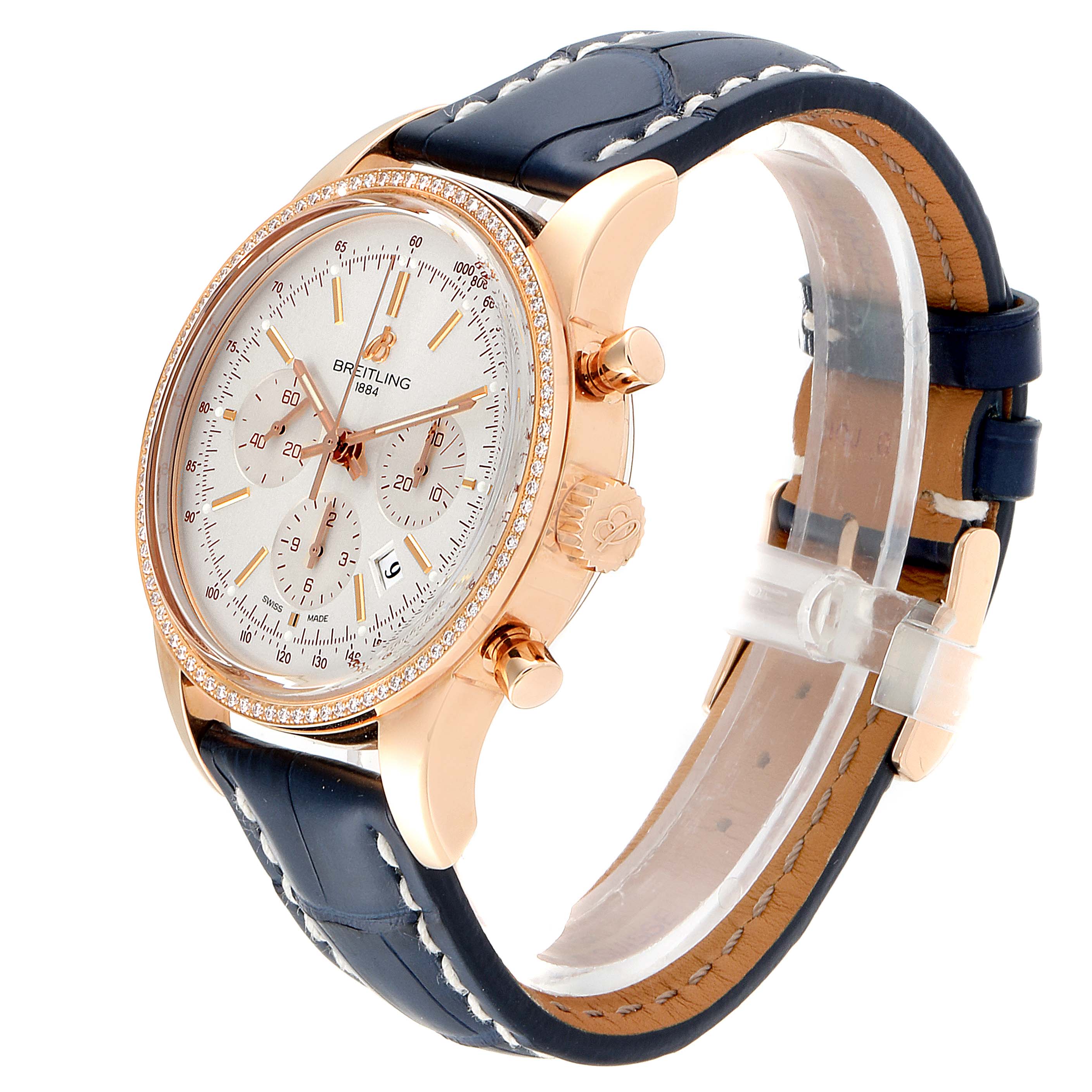 The Breitling Transocean RB0152 Men's Rose Gold Silver Dial RB0152 Men's Rose Gold Silver Dial watch is shown at an oblique angle, displaying the face, bezel, crown, chronograph buttons, and leather strap.