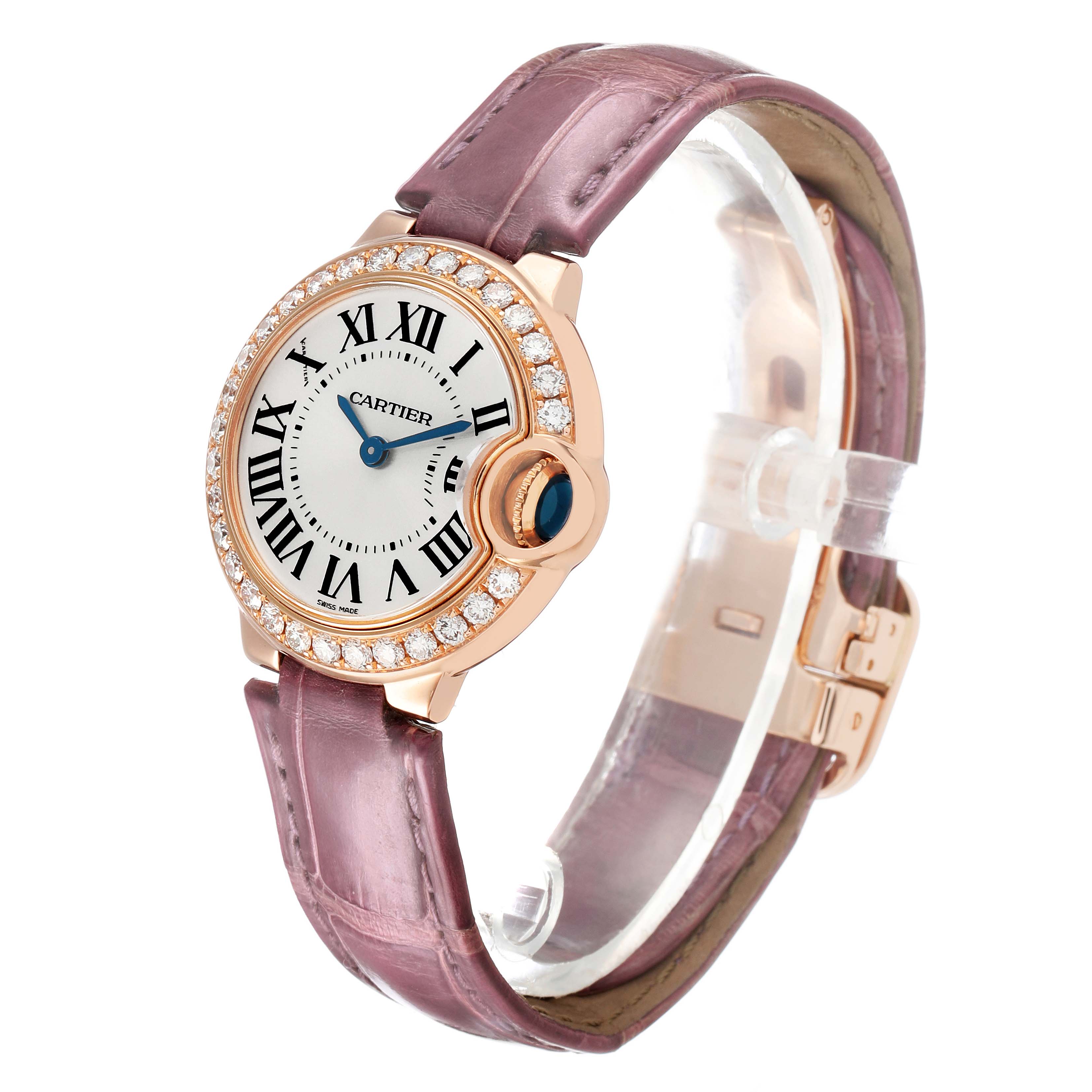 The Cartier Ballon Bleu WE900251 Women's Rose Gold Silver Dial watch is shown at a three-quarter angle, highlighting the diamond bezel, pink strap, and blue cabochon crown.