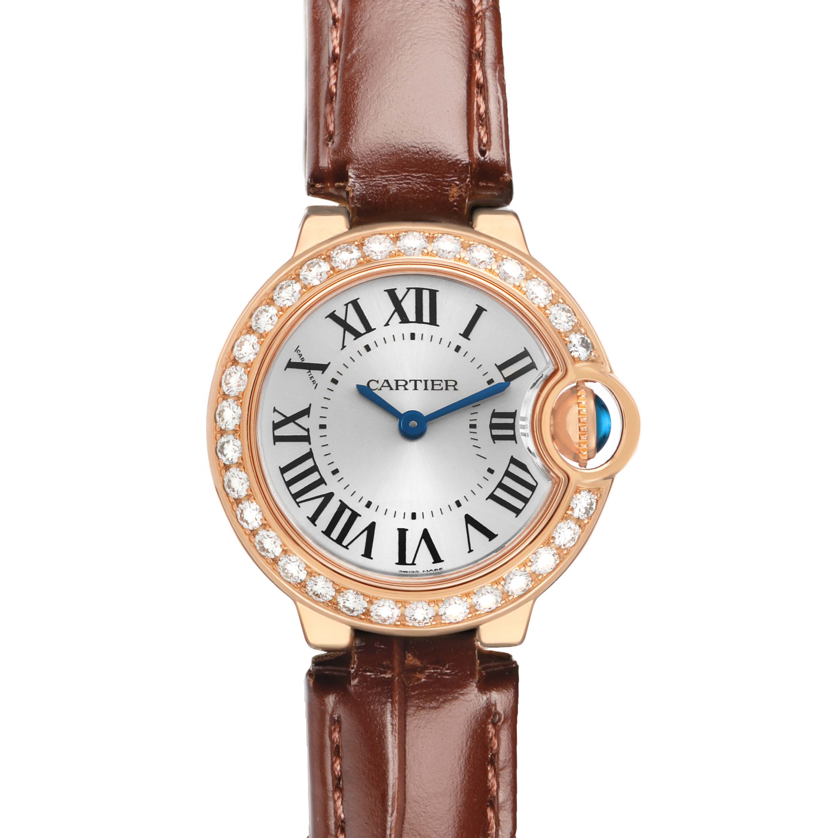 The Cartier Ballon Bleu WE900251 Women's Rose Gold Silver Dial watch is shown from a frontal angle, highlighting its face, diamond bezel, and leather strap.