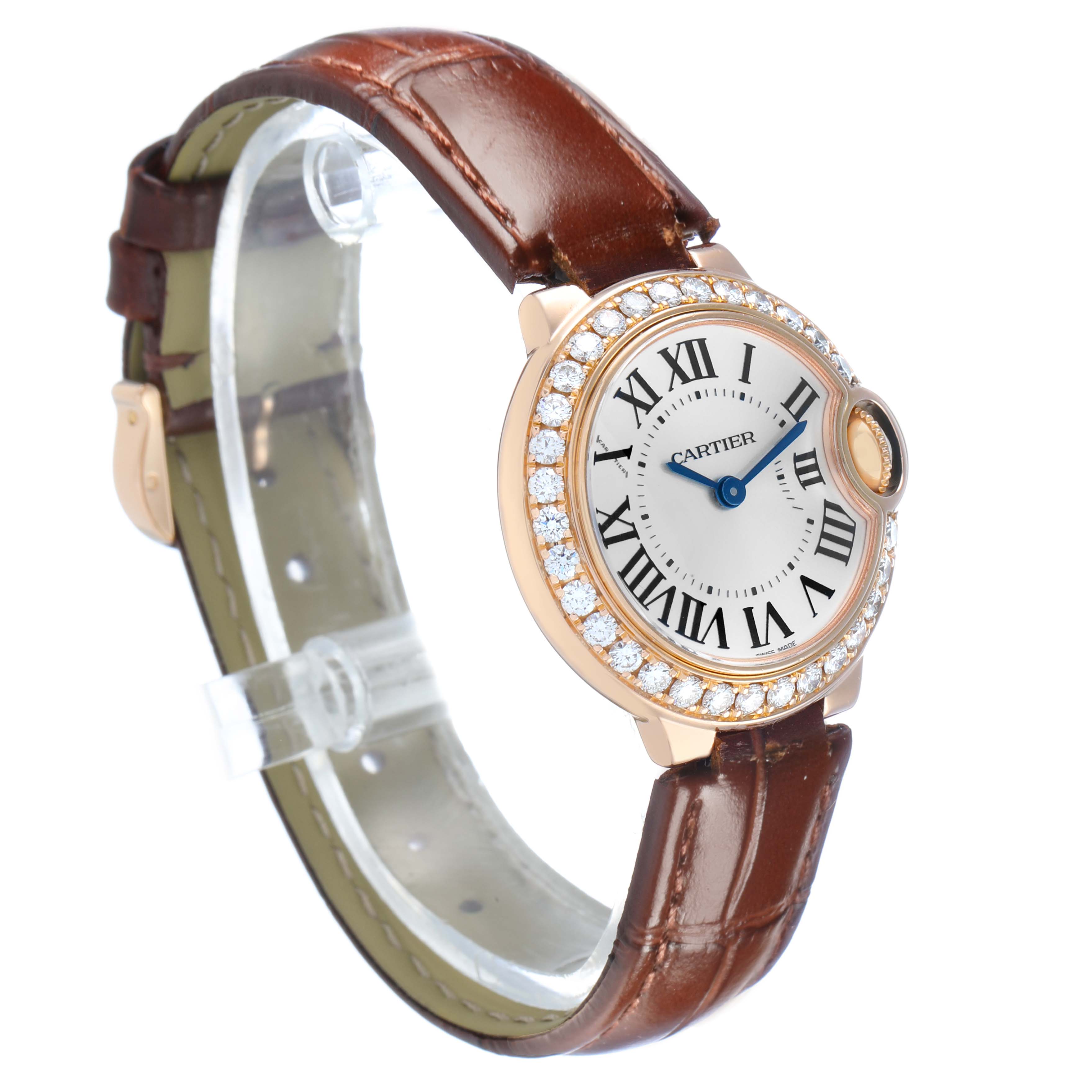 The image shows a Cartier Ballon Bleu WE900251 Women's Rose Gold Silver Dial watch at a slight side angle, highlighting its round face, diamond bezel, and brown leather strap.