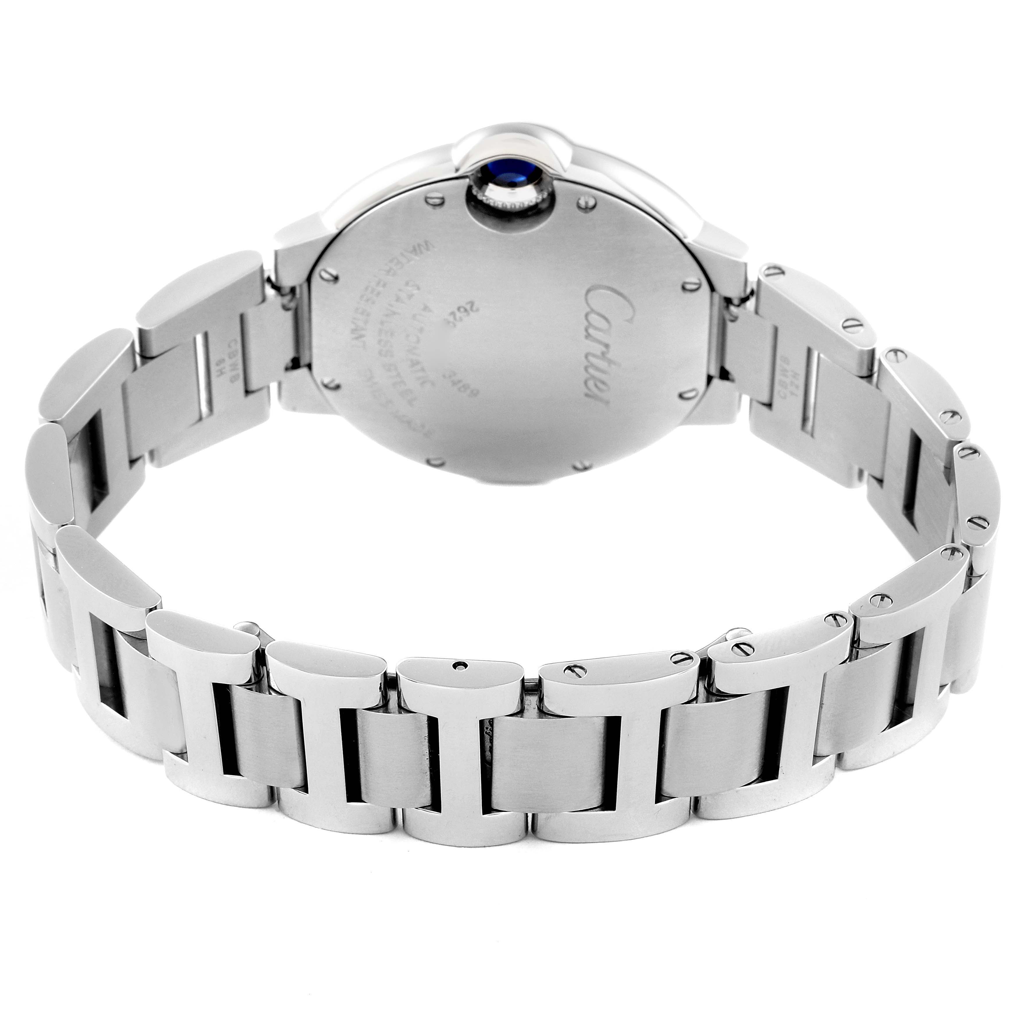 The image shows the back of the Cartier Ballon Bleu WE902074 Women
s Stainless Steel Silver Dial WE902074 Women
s Stainless Steel Silver Dial watch, featuring its stainless steel bracelet and engraved caseback.