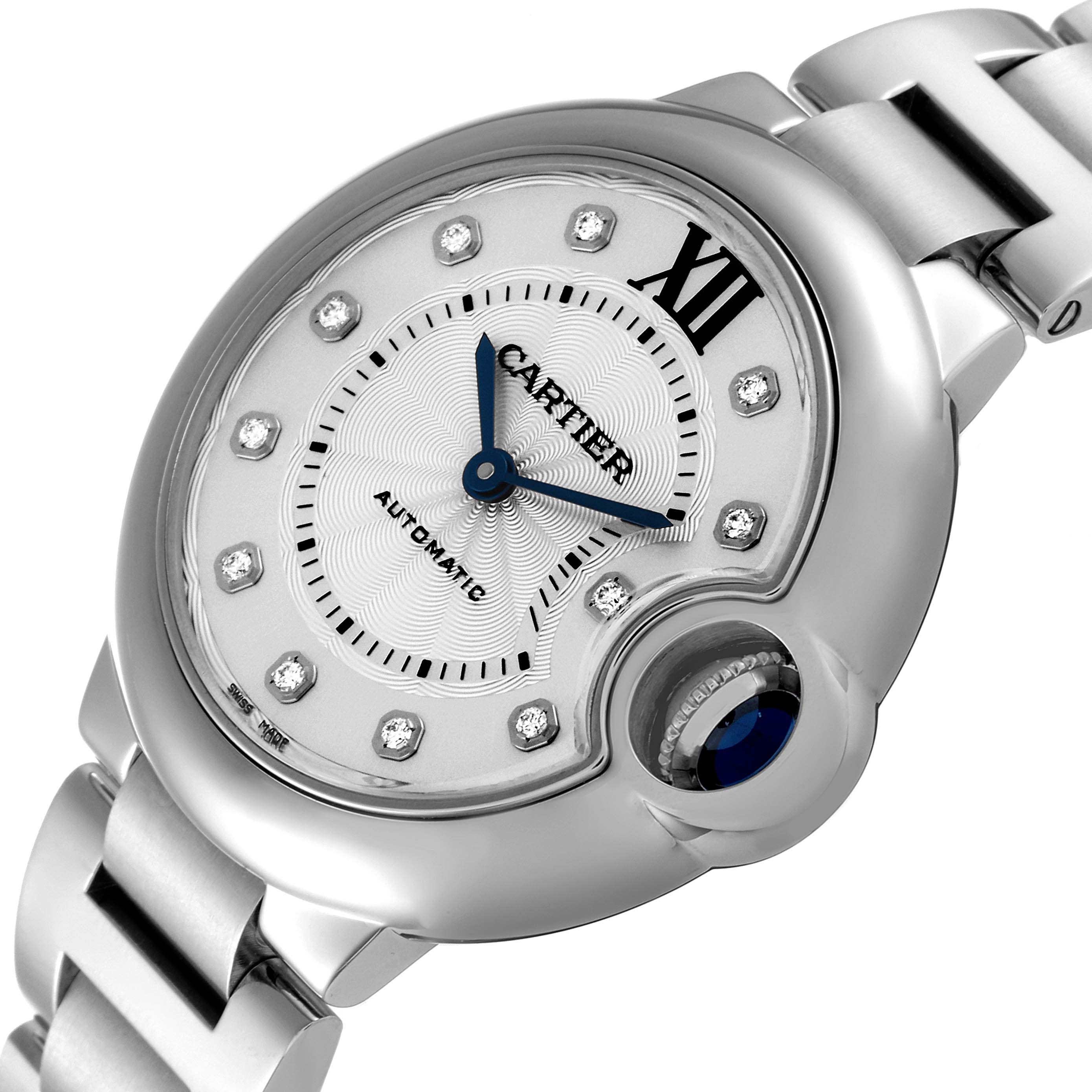 This is a close-up view of the Cartier Ballon Bleu WE902074 Women
s Stainless Steel Silver Dial WE902074 Women
s Stainless Steel Silver Dial watch showcasing its dial, crown, and part of the bracelet.
