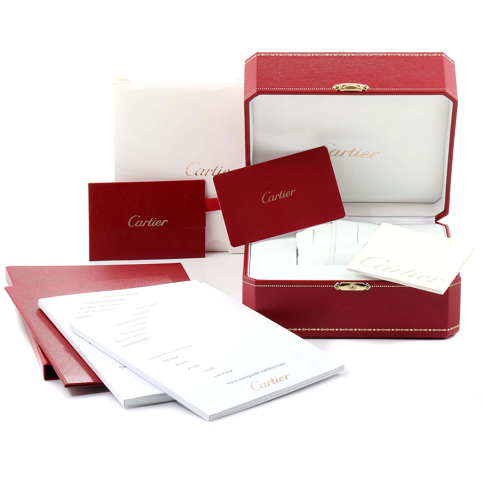 The image shows the packaging and documentation parts for a Cartier Ballon Bleu WE902061 Women
s Steel and Gold (two tone) Silver Dial WE902061 Women
s Steel and Gold (two tone) Silver Dial watch, including the box, manuals, and certificates.