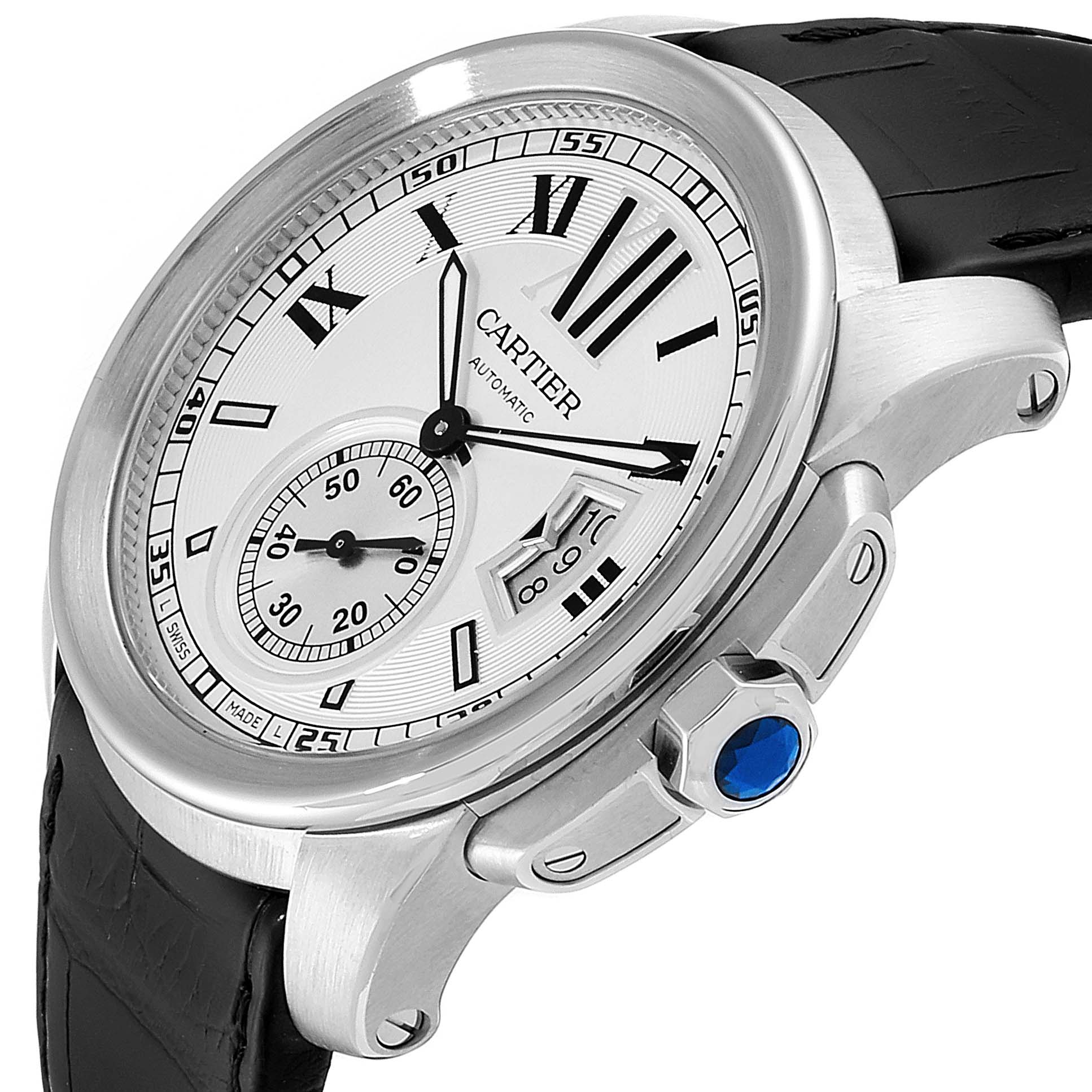The image shows a Calibre de Cartier watch by Cartier at an angle highlighting the watch face, crown, and part of the leather strap.