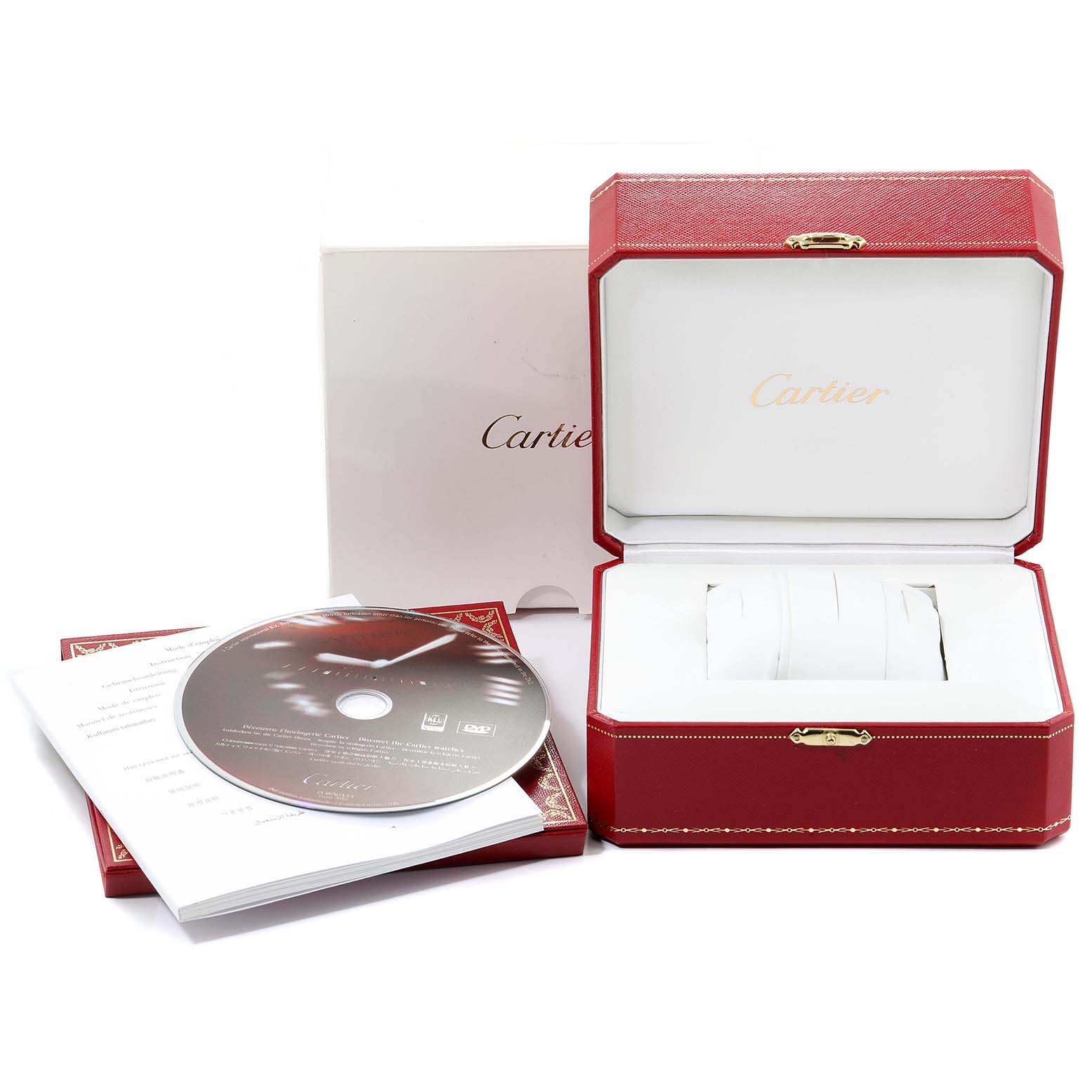 The image shows the accessories for a Calibre de Cartier watch, including a box, manual, and a CD, all viewed from the front.