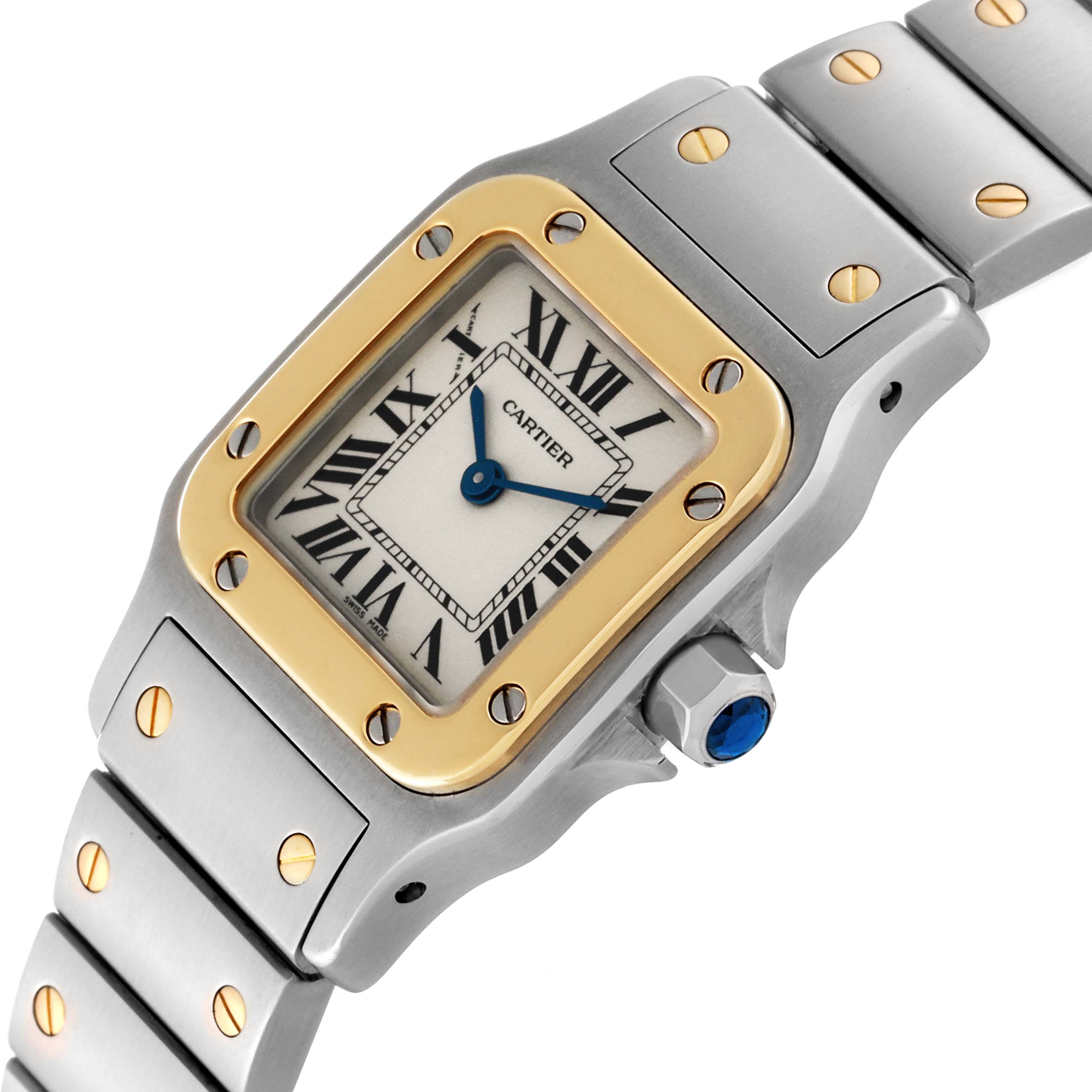 The image shows a close-up of the Santos model Cartier watch, highlighting the face, crown, and part of the bracelet.