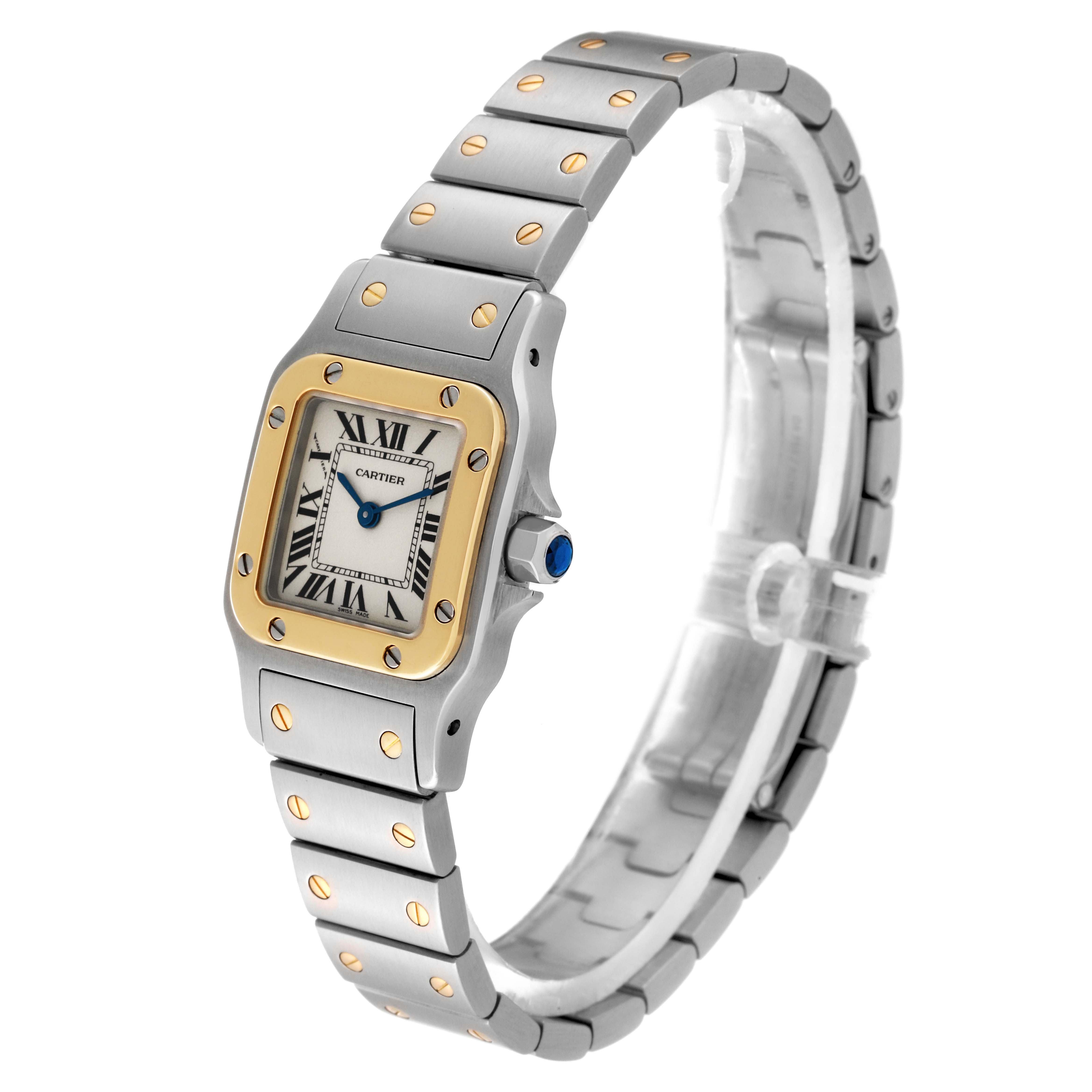 The image shows a Santos model by Cartier from a 3/4 angle, highlighting its dial, bezel, and bracelet.