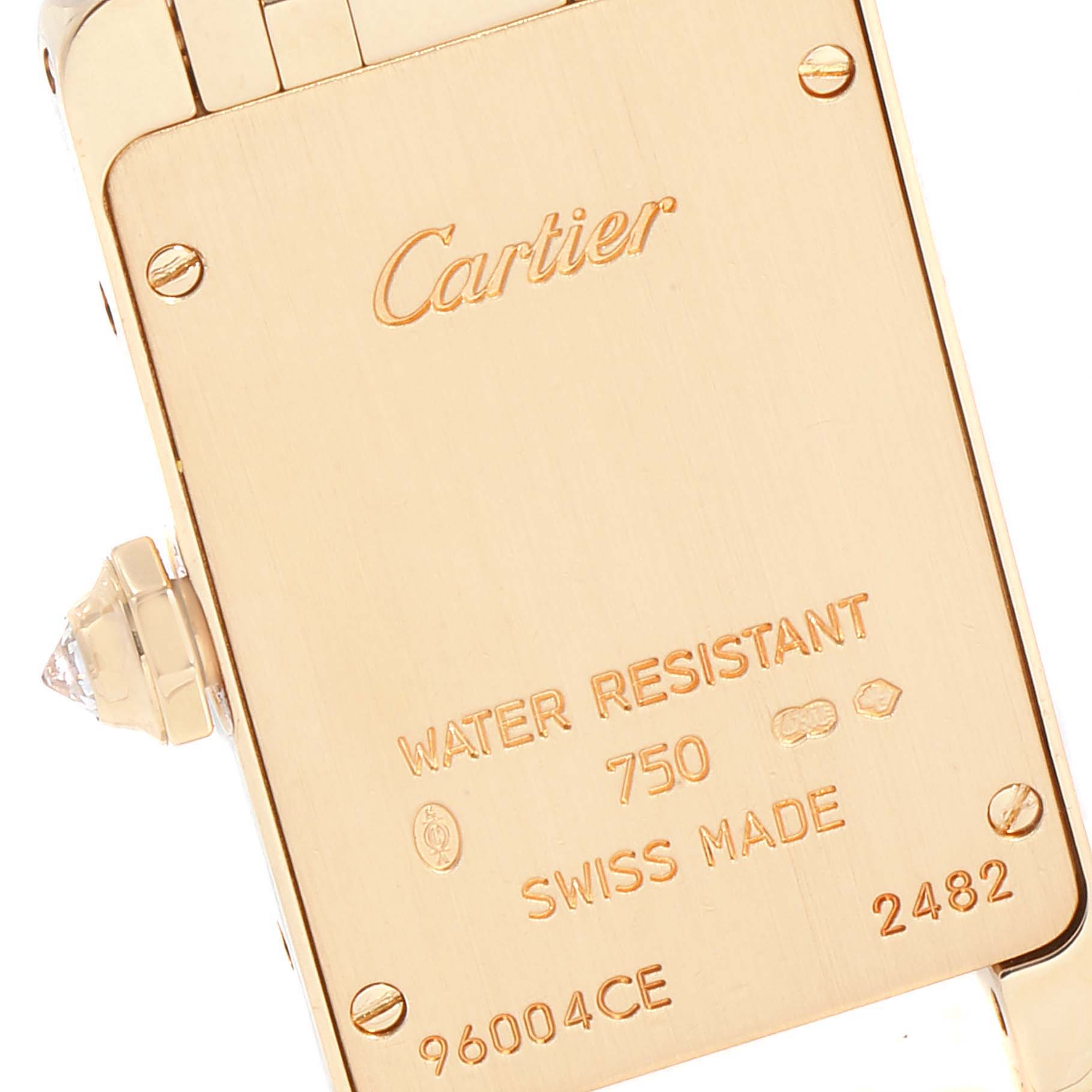 The image shows the back case of the Cartier Tank Américaine watch, highlighting the brand, model, and inscriptions on it.