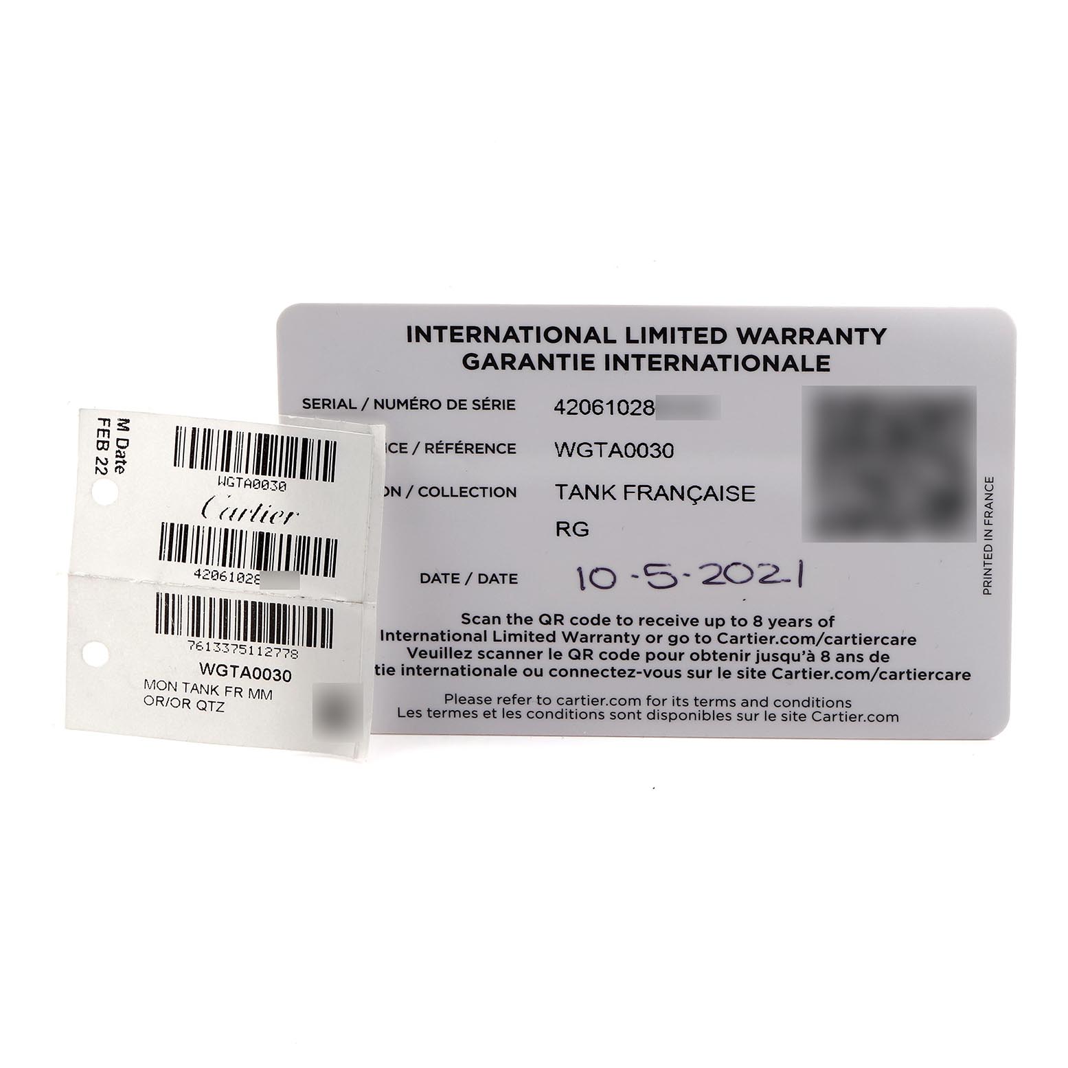 The image shows warranty and tag cards for a Cartier Tank Française watch, displaying model details and date of purchase.