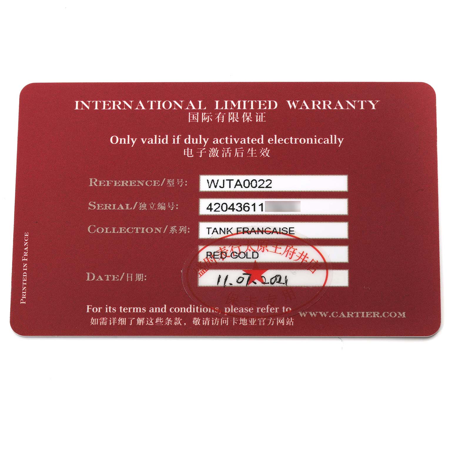 This is an angled shot of the International Limited Warranty card for the Cartier Tank Française model.