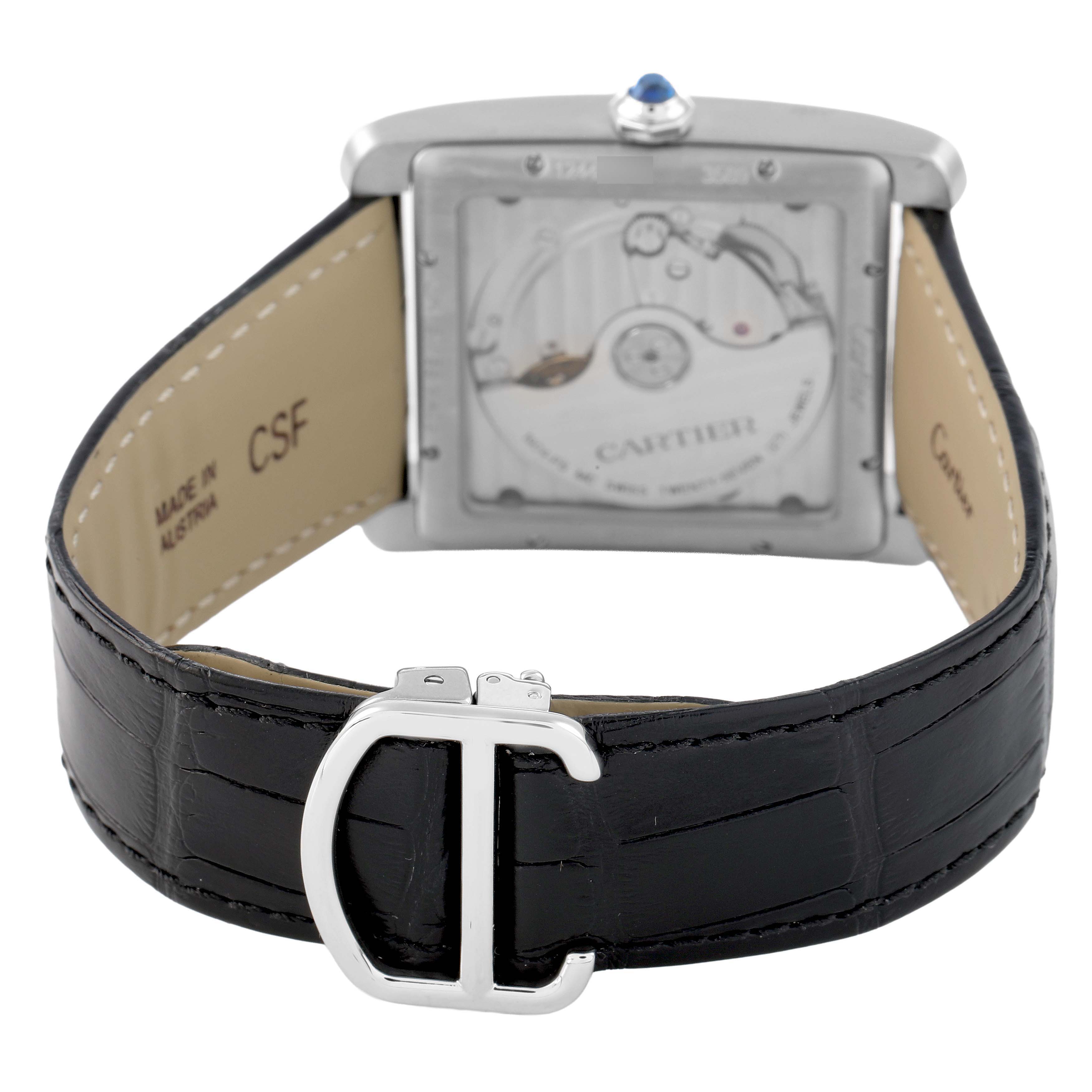 The Cartier Tank MC W5330004 Men's Stainless Steel Black Dial watch is shown from the back, highlighting its transparent case back and black leather strap with buckle.