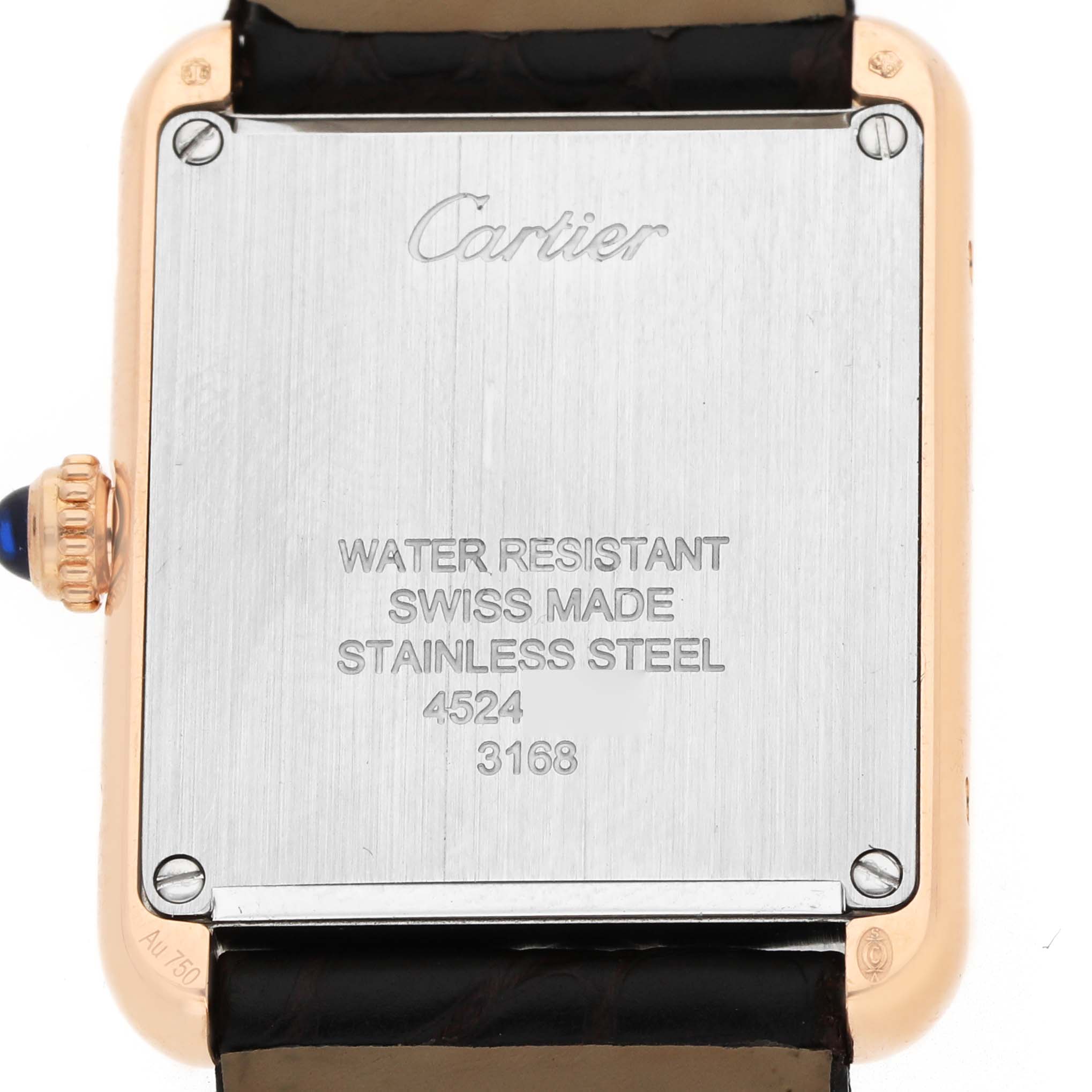 The image shows the back case of a Cartier Tank Solo W5200024 Women's Rose Gold Silver Dial watch, featuring inscriptions and a sapphire crown side view.