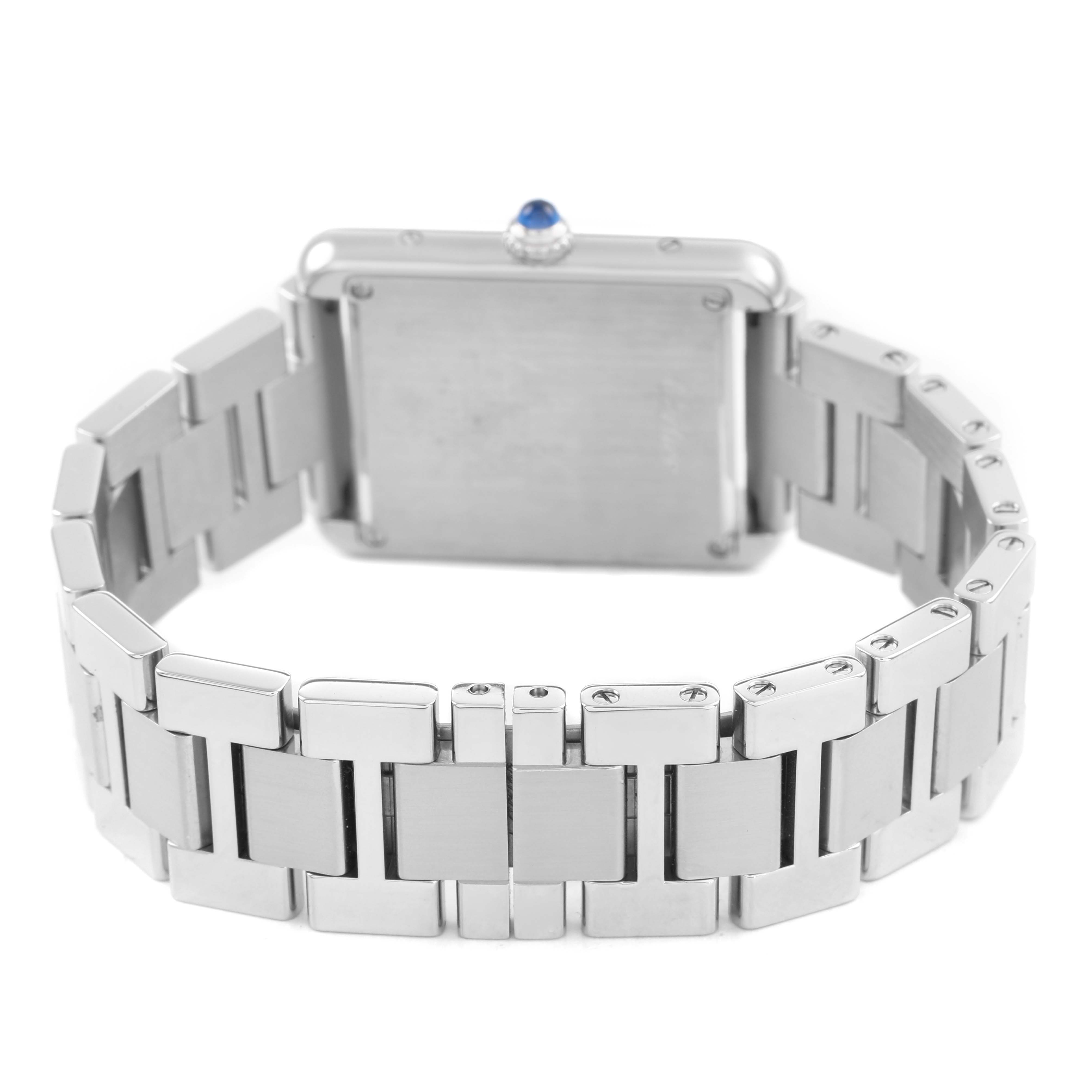 The image shows the back of the Cartier Tank Solo W5200013 Women's Stainless Steel Silver Dial watch, highlighting the case back and metal bracelet links.