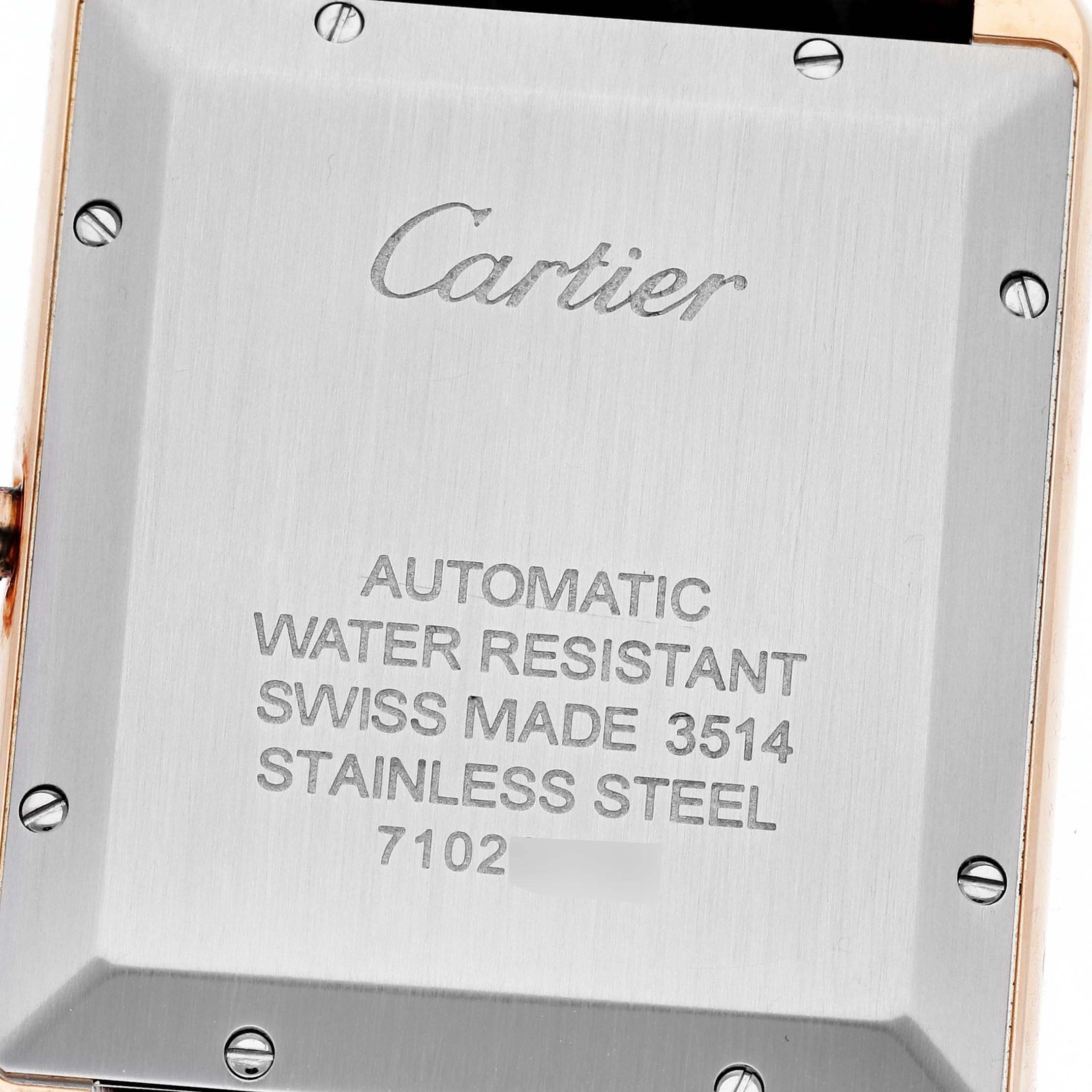 This image shows the case back of a Cartier Tank Solo W5200026 Men
s Steel and Gold (two tone) Silver Dial W5200026 Men
s Steel and Gold (two tone) Silver Dial watch, featuring engraved details.