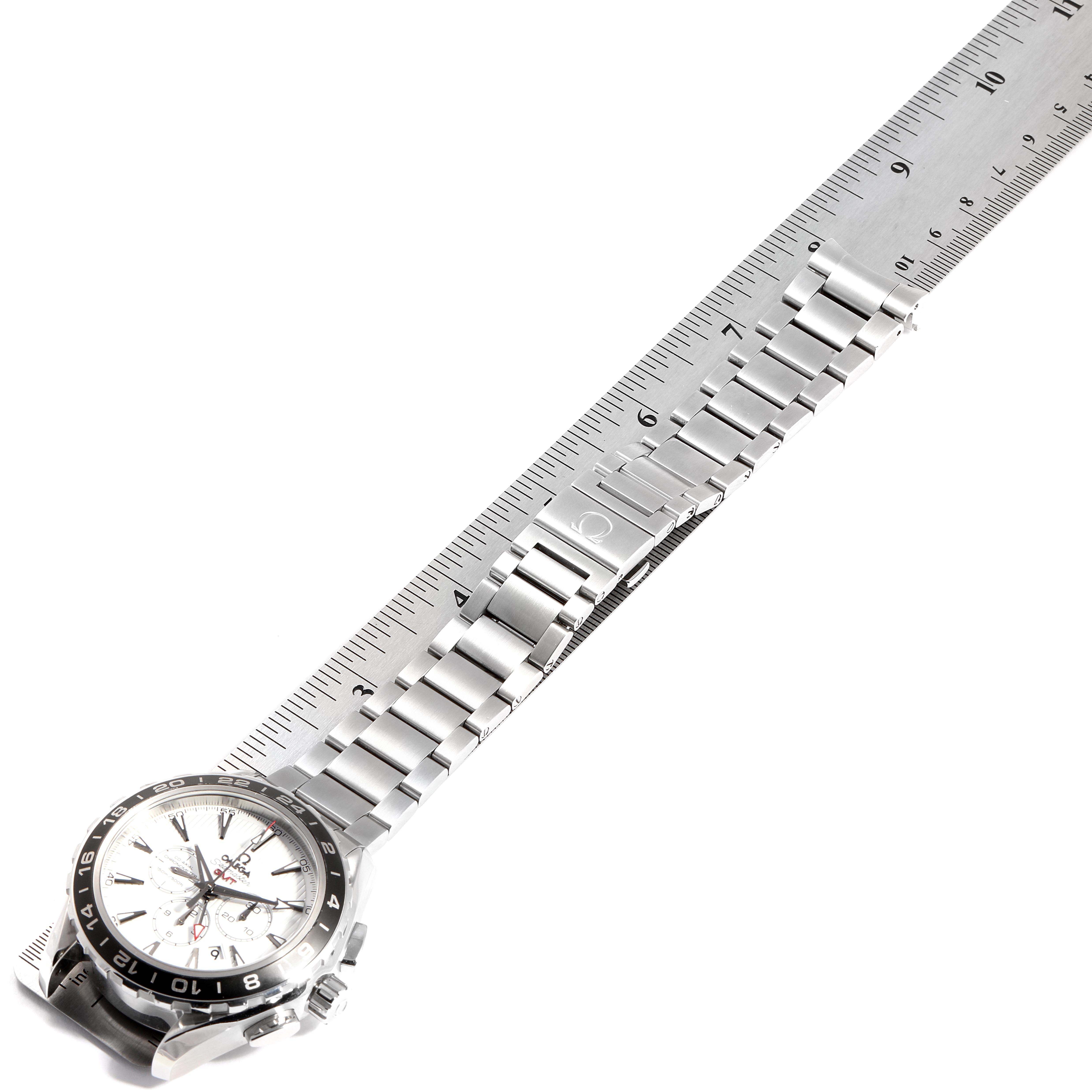 The image shows the Omega Aqua Terra 231.10.44.52.04.001 Men
s Stainless Steel White Dial 231.10.44.52.04.001 Men
s Stainless Steel White Dial watch laid flat, with its stainless steel bracelet and clasp, next to a ruler for scale.