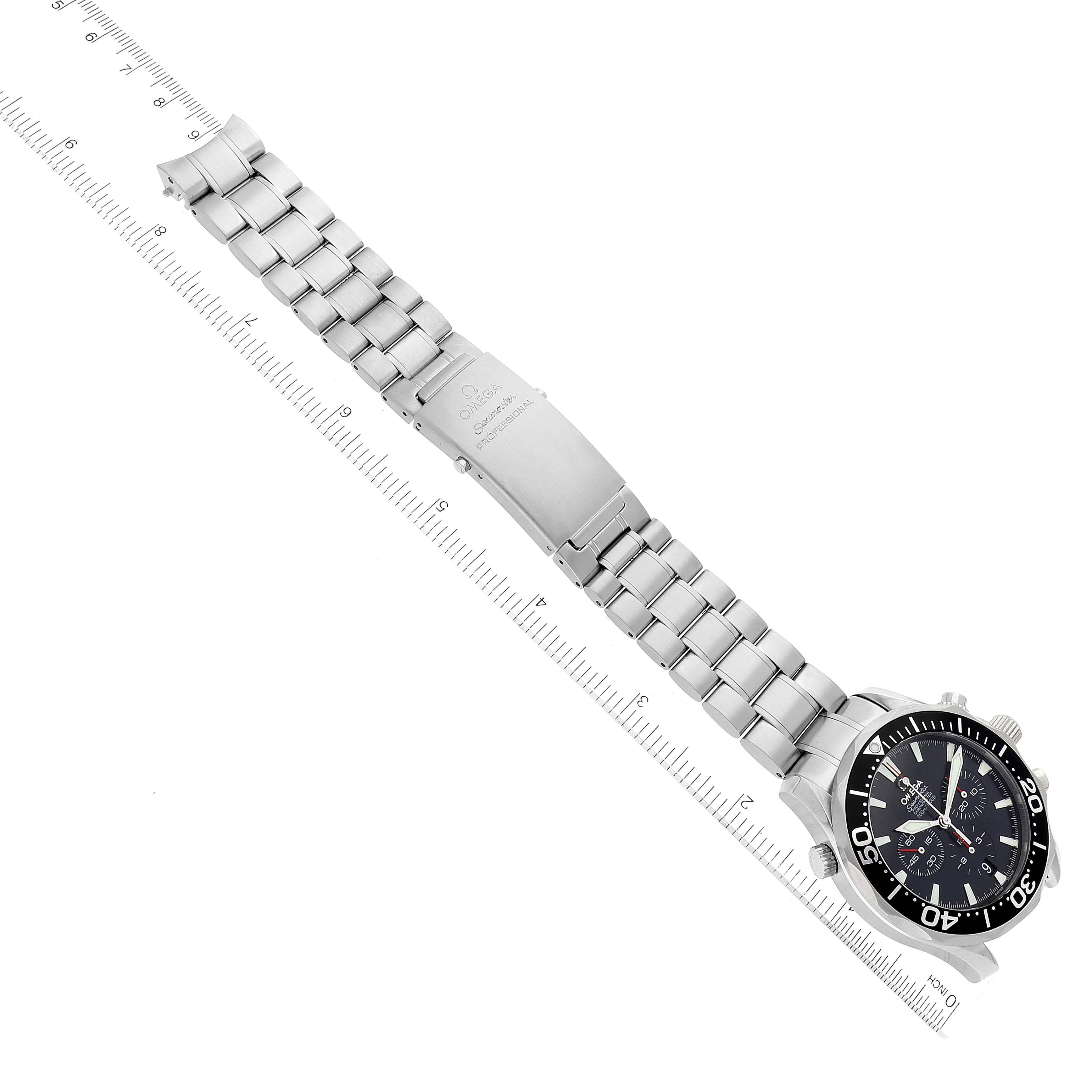 The image shows an Omega Seamaster 2594.52.00 Men's Stainless Steel Black Dial 2594.52.00 Men's Stainless Steel Black Dial watch laid flat, displaying its stainless steel bracelet and clasp alongside a ruler for scale.