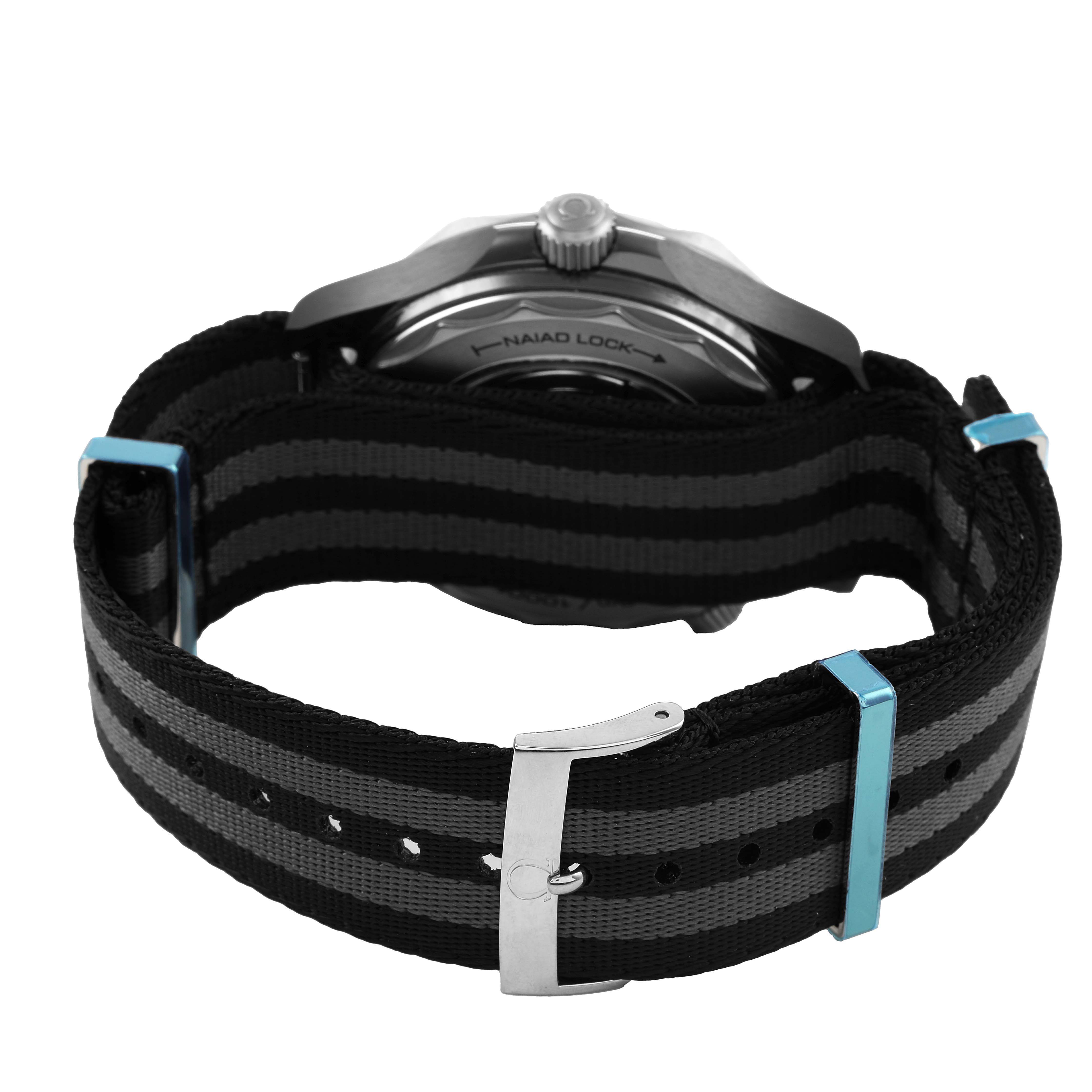 The image shows the side view of an Omega Seamaster 210.92.44.20.01.001 Men's Ceramic Black Dial, highlighting the case back and black and gray striped fabric strap with a buckle.