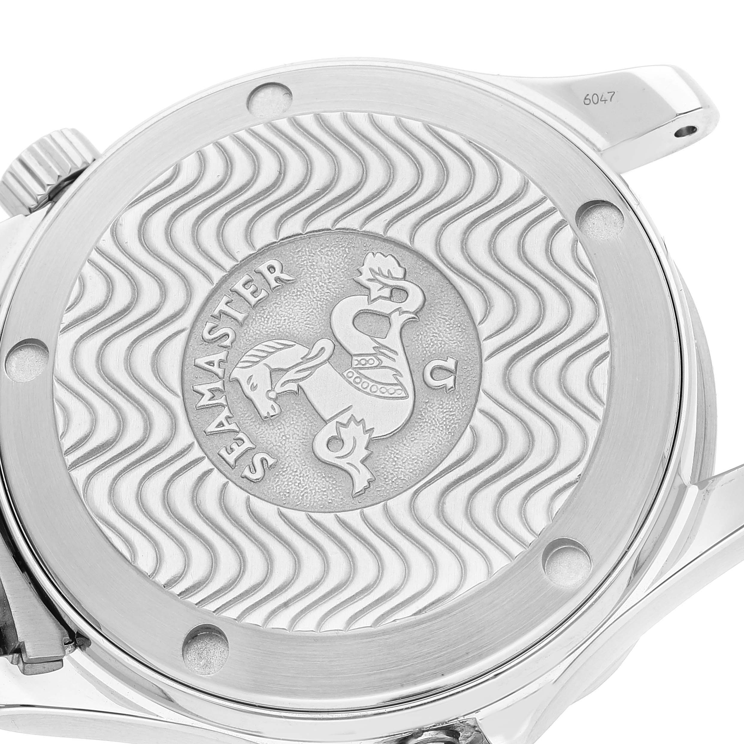 This image shows the case back of an Omega Seamaster watch, with its signature wave pattern and emblem.