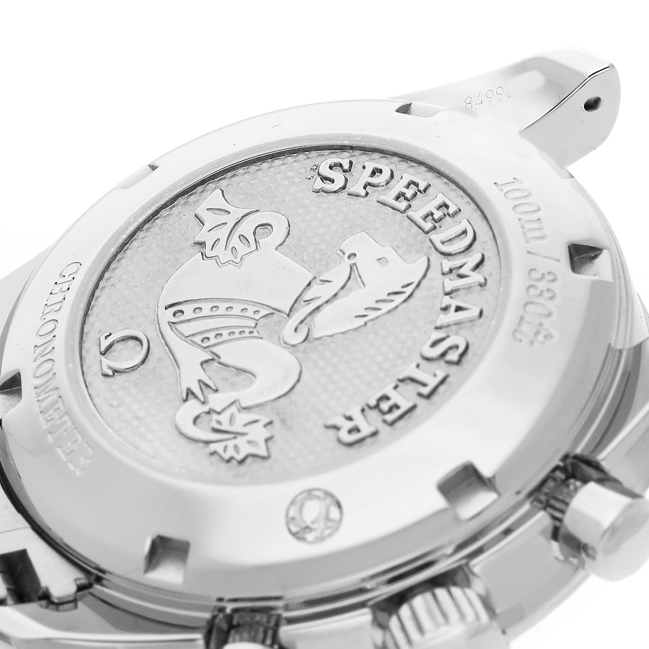 The image shows the case back of an Omega Speedmaster 324.30.38.40.06.001 Men's Stainless Steel Grey Dial, featuring the engraved logo and model details, viewed from an angled perspective.