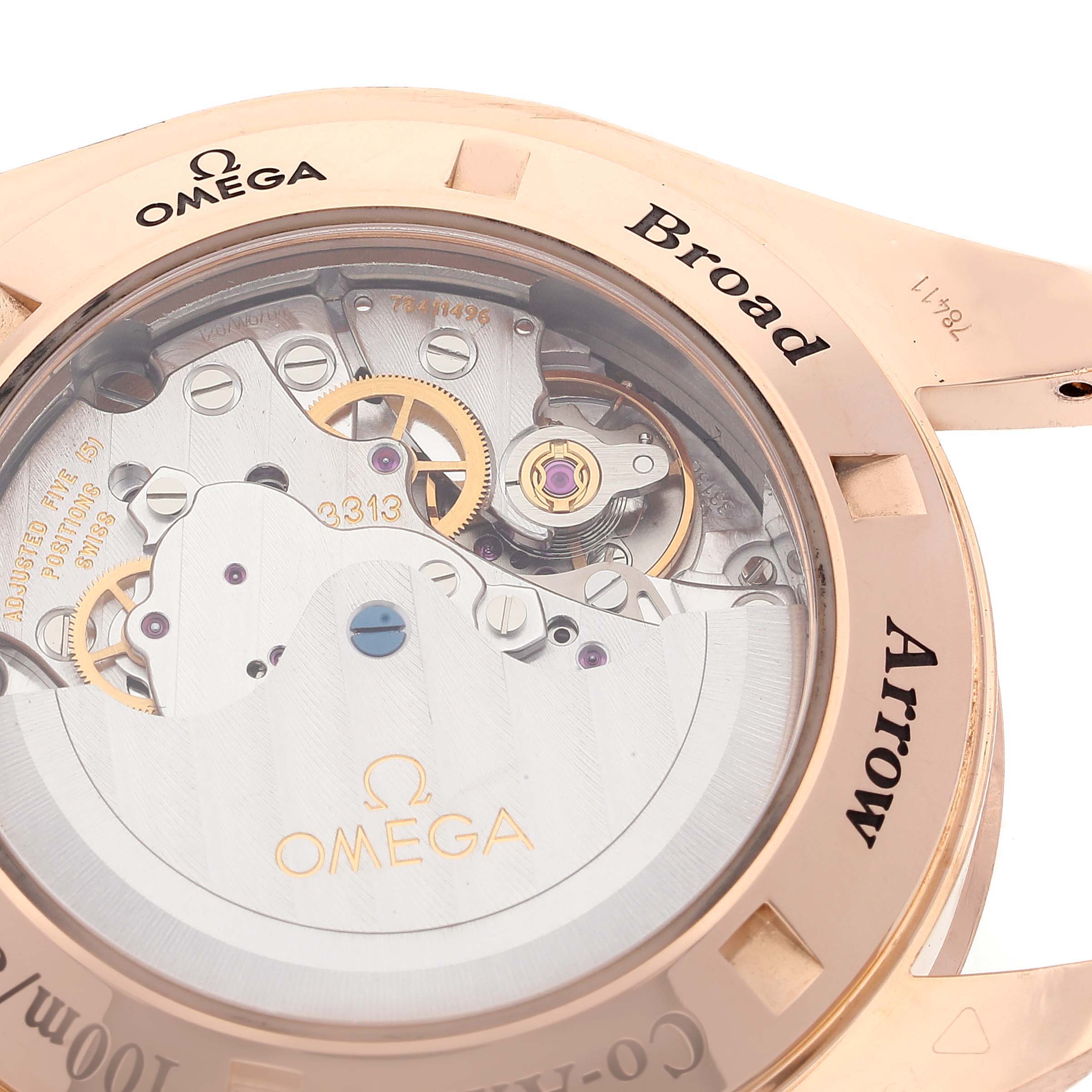 The image shows the back case and internal mechanical workings of an Omega Speedmaster 321.53.42.50.01.001 Men
s Rose Gold Black Dial 321.53.42.50.01.001 Men
s Rose Gold Black Dial Broad Arrow watch.