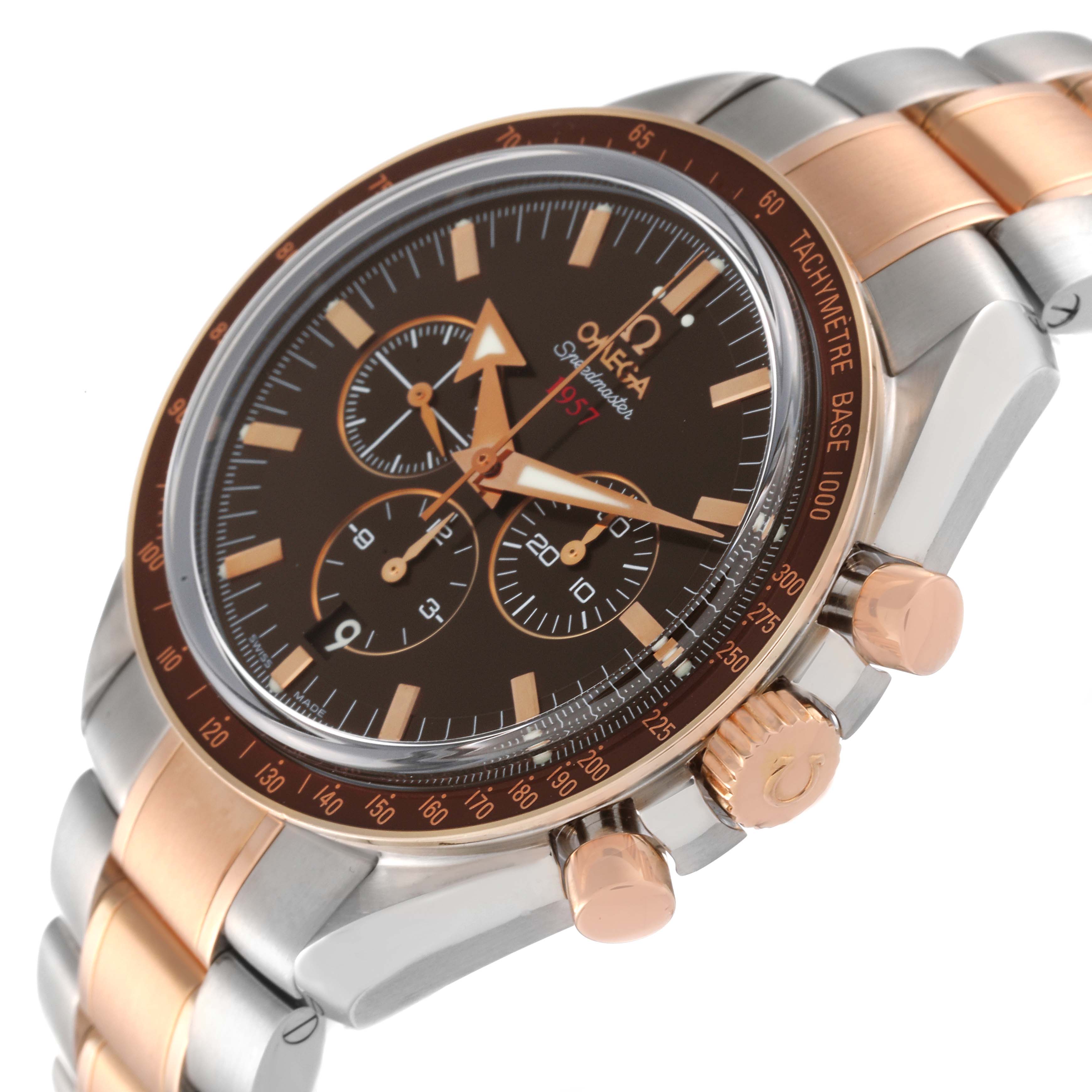 The Omega Speedmaster 321.90.42.50.13.001 Men's Steel and Gold (two tone) Brown Dial 321.90.42.50.13.001 Men's Steel and Gold (two tone) Brown Dial watch is shown at an angle highlighting the face, bezel, crown, pushers, and part of the bracelet.