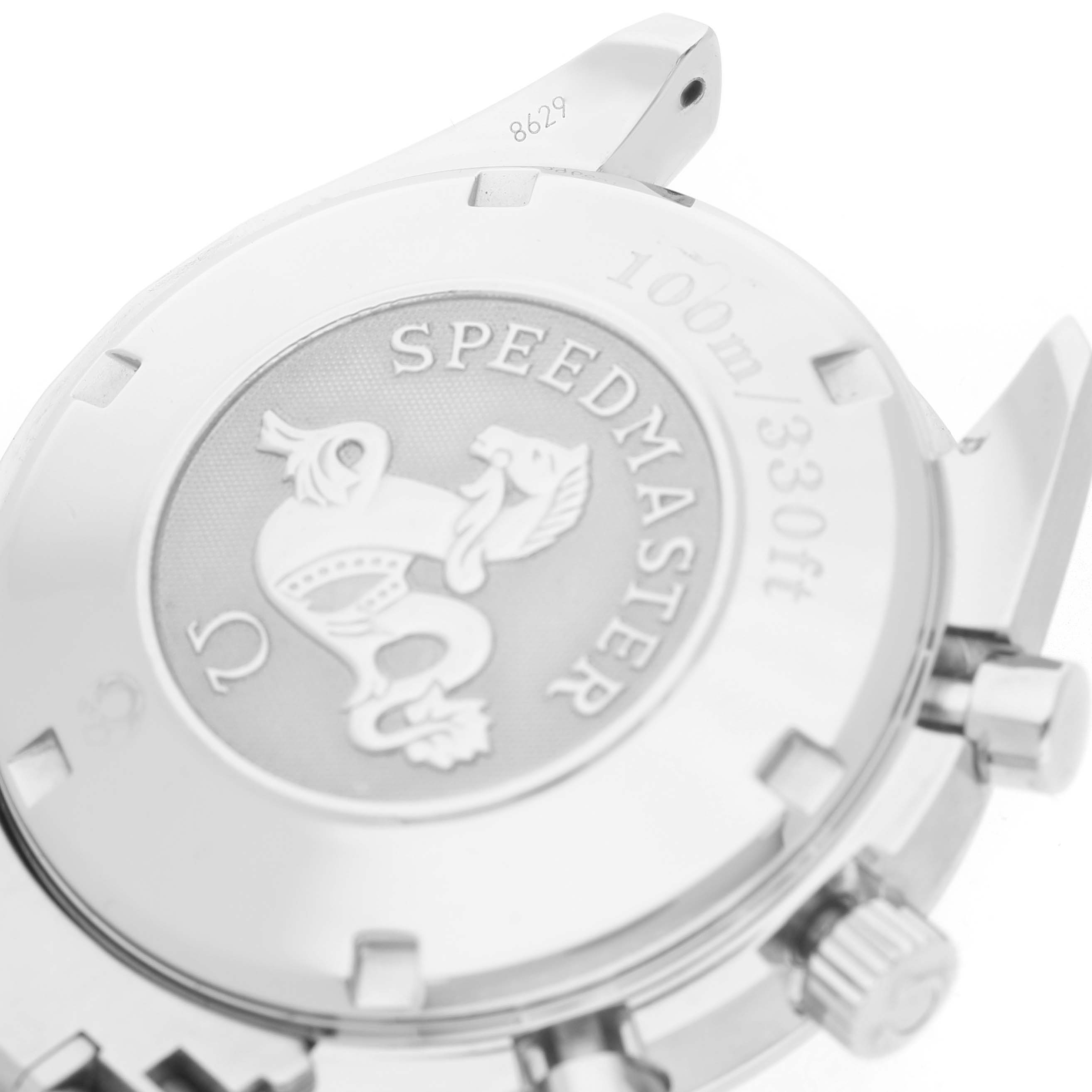 The image shows the case back and side view of an Omega Speedmaster 3210.50.00 Men's Stainless Steel Black Dial, highlighting the engraving and pushers.
