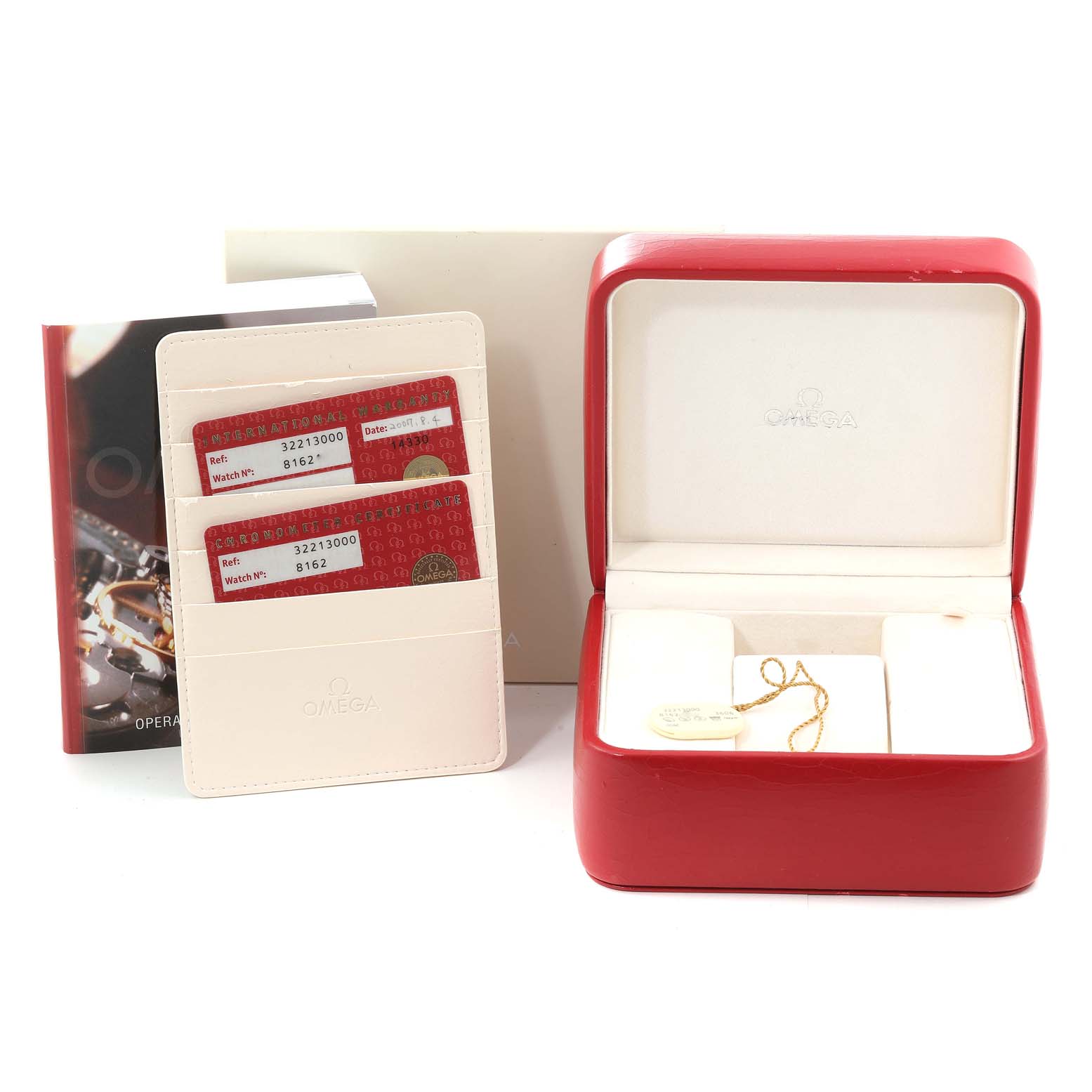 The image shows an Omega Speedmaster 3221.30.00 Men's Stainless Steel Silver Dial 3221.30.00 Men's Stainless Steel Silver Dial watch's red storage box, cards, cardholder, and manual.