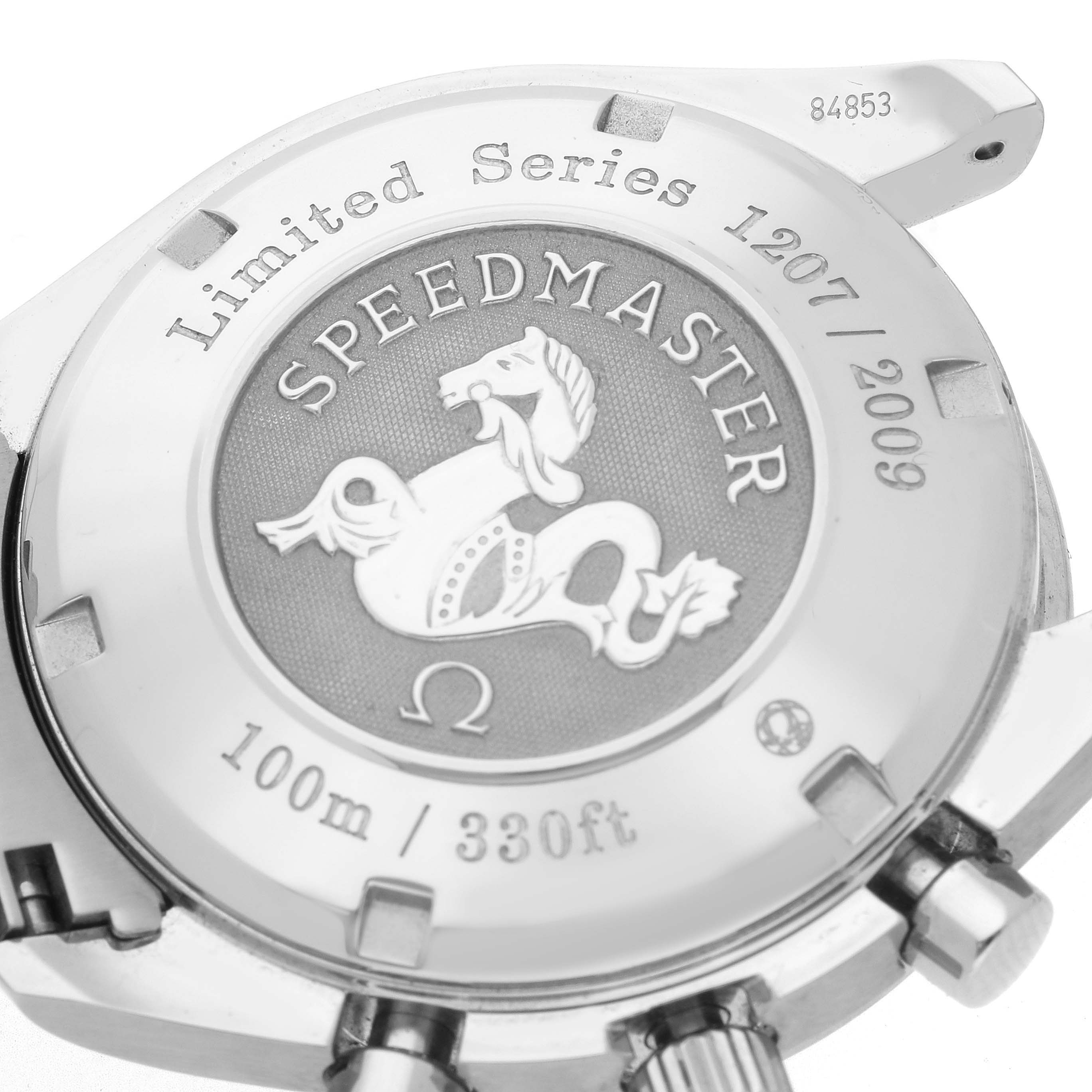 The image shows the case back of an Omega Speedmaster 323.30.40.40.02.001 Men
s Stainless Steel White Dial 323.30.40.40.02.001 Men
s Stainless Steel White Dial, highlighting the engraved logo and limited series details.
