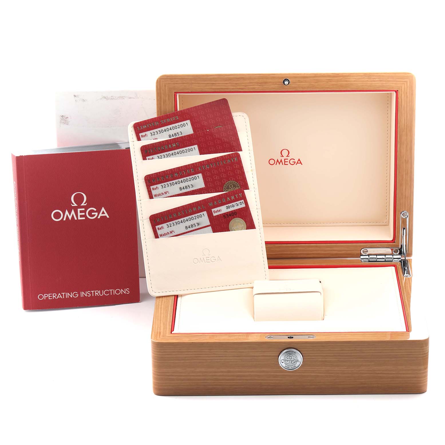 The image shows the Omega Speedmaster 323.30.40.40.02.001 Men
s Stainless Steel White Dial 323.30.40.40.02.001 Men
s Stainless Steel White Dial
s open wooden box, operating instructions booklet, and warranty cards.